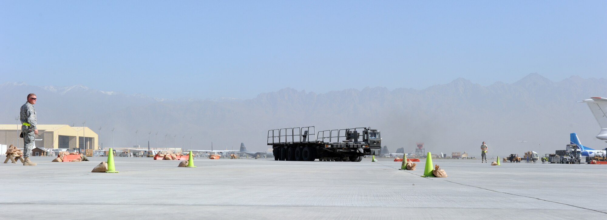 Airmen assigned to the 455th Expedtionary Aerial Port Squadron at Bagram Airfield, Afghanistan, drive a Tunner 60K loader through an obstacle course on the flightline here Oct. 3, 2010. The course was part of a class meant to reinforce safe operational practices. The loader is named after the late Lt. Gen. William H. Tunner, a former commander of U.S. Air Forces in Europe.(U.S. Air Force Photo/Tech. Sgt. Drew Nystrom