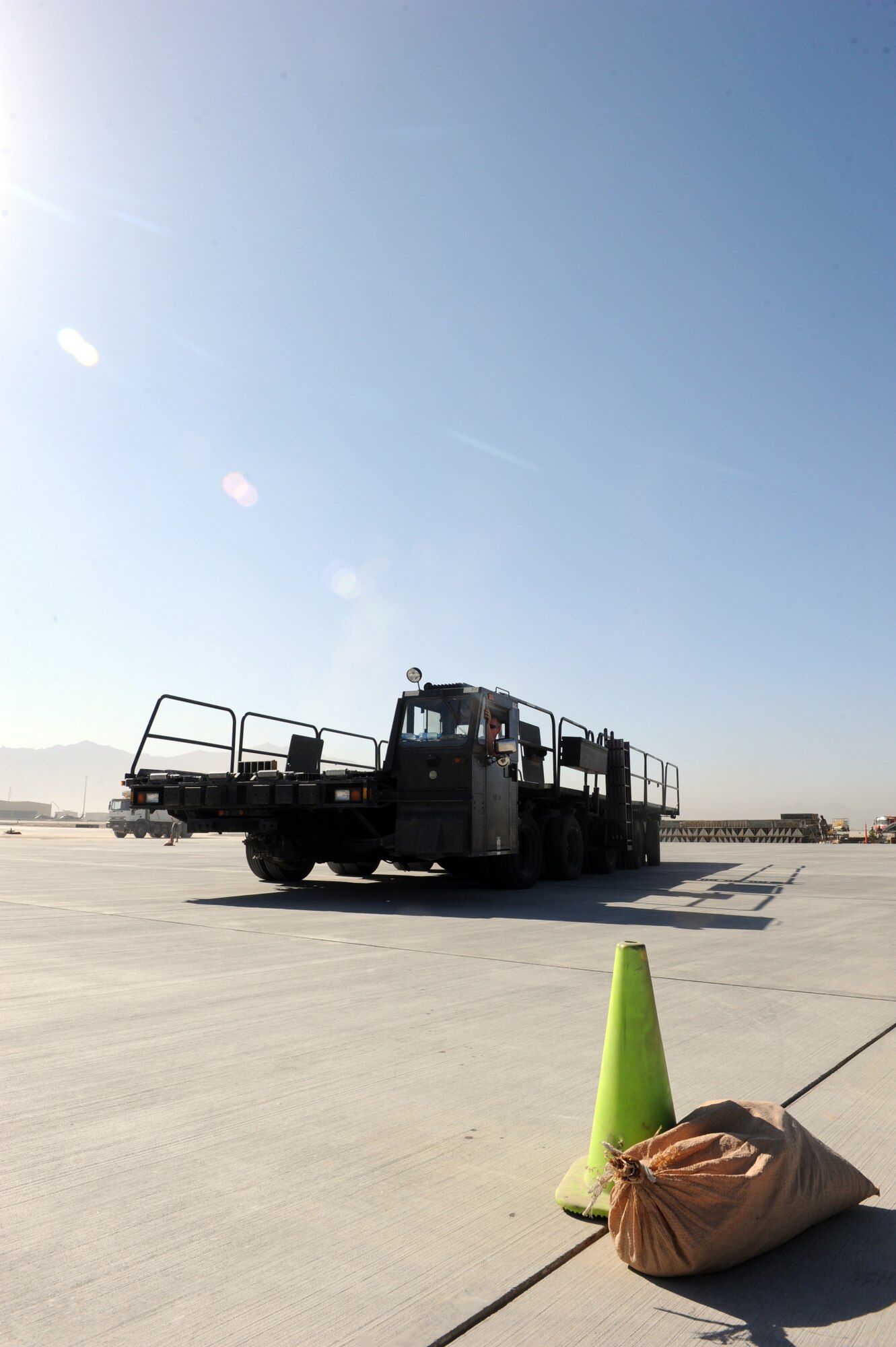 Airmen assigned to the 455th Expedtionary Aerial Port Squadron at Bagram Airfield, Afghanistan, drive a Tunner 60K loader through an obstacle course on the flightline here Oct. 3, 2010. The course was part of a class meant to reinforce safe operational practices. The loader is named after the late Lt. Gen. William H. Tunner, a former commander of U.S. Air Forces in Europe.(U.S. Air Force Photo/Tech. Sgt. Drew Nystrom