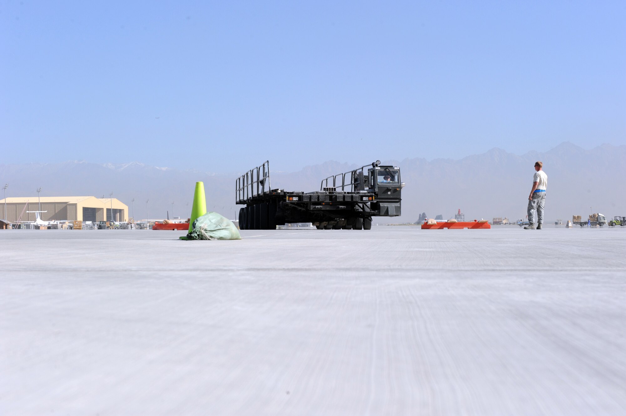 Airmen assigned to the 455th Expedtionary Aerial Port Squadron at Bagram Airfield, Afghanistan, drive a Tunner 60K loader through an obstacle course on the flightline here Oct. 3, 2010. The course was part of a class meant to reinforce safe operational practices. The loader is named after the late Lt. Gen. William H. Tunner, a former commander of U.S. Air Forces in Europe.(U.S. Air Force Photo/Tech. Sgt. Drew Nystrom