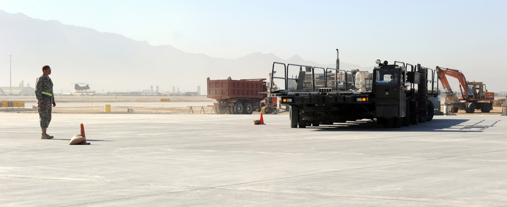 Airmen assigned to the 455th Expedtionary Aerial Port Squadron at Bagram Airfield, Afghanistan, drive a Tunner 60K loader through an obstacle course on the flightline here Oct. 3, 2010 as safety instructors observe. The course was part of a class meant to reinforce safe operational practices. The loader is named after the late Lt. Gen. William H. Tunner, a former commander of U.S. Air Forces in Europe.(U.S. Air Force Photo/Tech. Sgt. Drew Nystrom