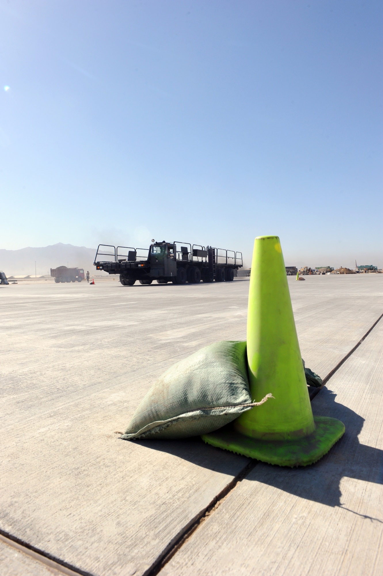 Airmen assigned to the 455th Expedtionary Aerial Port Squadron at Bagram Airfield, Afghanistan, drive a Tunner 60K loader through an obstacle course on the flightline here Oct. 3, 2010. The course was part of a class meant to reinforce safe operational practices. The loader is named after the late Lt. Gen. William H. Tunner, a former commander of U.S. Air Forces in Europe.(U.S. Air Force Photo/Tech. Sgt. Drew Nystrom)