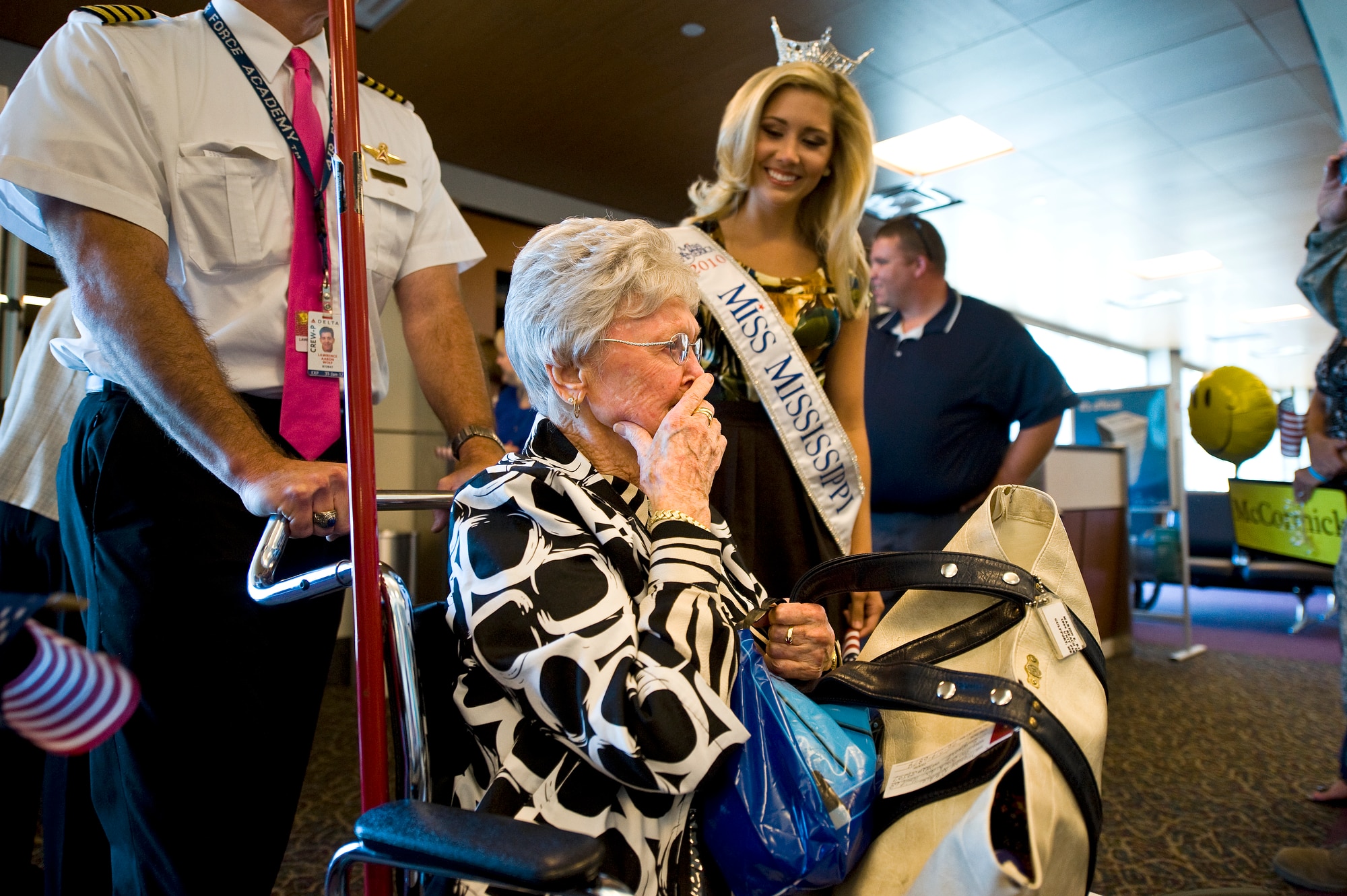 About 110 displaced residents of Armed Forces Retirement Home in Gulfport, Miss., arrive to a hero's welcome at the airport Oct. 4, 2010, from Washington D.C. Nearly 150 veterans returned home to south Mississippi after being forced to evacuate five years ago after Hurricane Katrina. (U.S. Air Force photo/Tech. Sgt. Bennie J. Davis III)