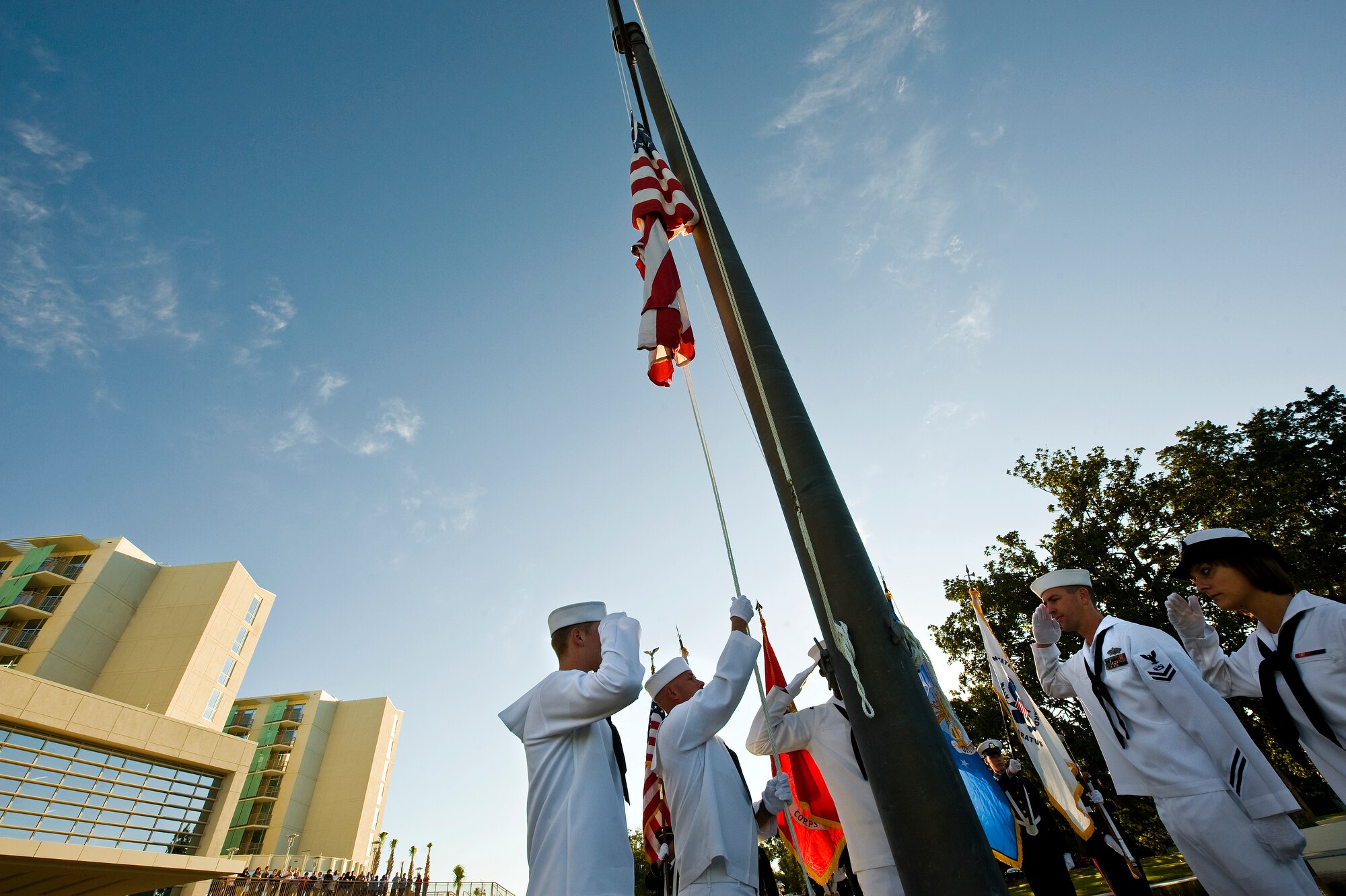 Naval honor guard members raise the U.S. Flag during an opening ceremony of the newly renovated Armed Forces Retirement Home in Gulfport, Miss., Oct. 4, 2010. About 150 veterans returned home to south Mississippi after being displaced five years ago after Hurricane Katrina.  (U.S. Air Force photo/Tech. Sgt. Bennie J. Davis III)