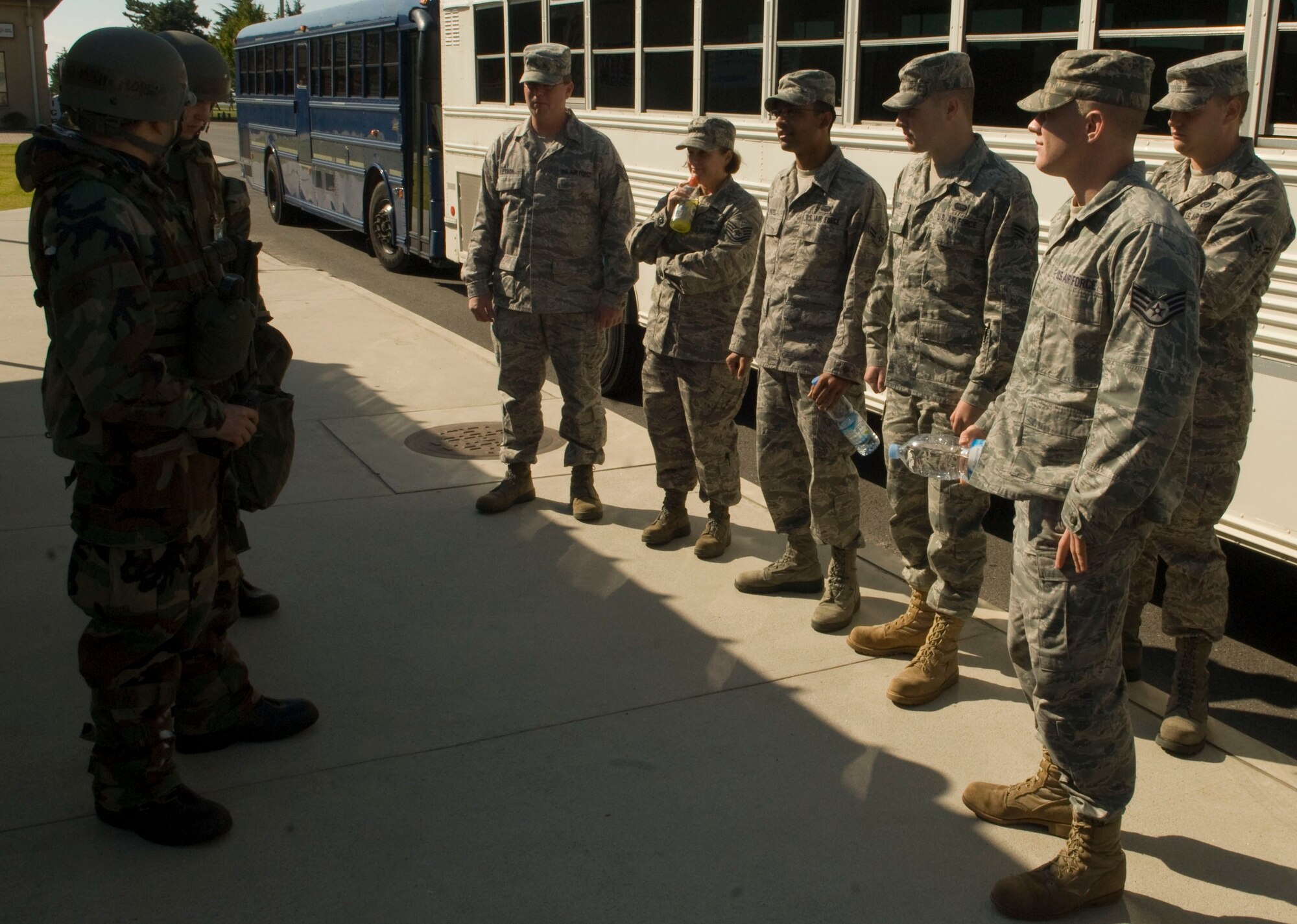 KUNSAN AIR BASE, Republic of Korea -- Staff Sgt. Kevin Flores 8th Force Support Squadron, briefs augmentees on their responsibilities as they enter the personnel deployment function during Exercise Beverly Midnight 10-04 here Oct. 5, 2010.  Members of the 8th Fighter Wing began exercising the Wolf Pack's three-part mission to defend the base, accept follow-on forces and take the fight north during Operational Readiness Exercise Beverly Midnight 10-04.(U.S. Air Force photo/Senior Airman Ciara Wymbs) 
