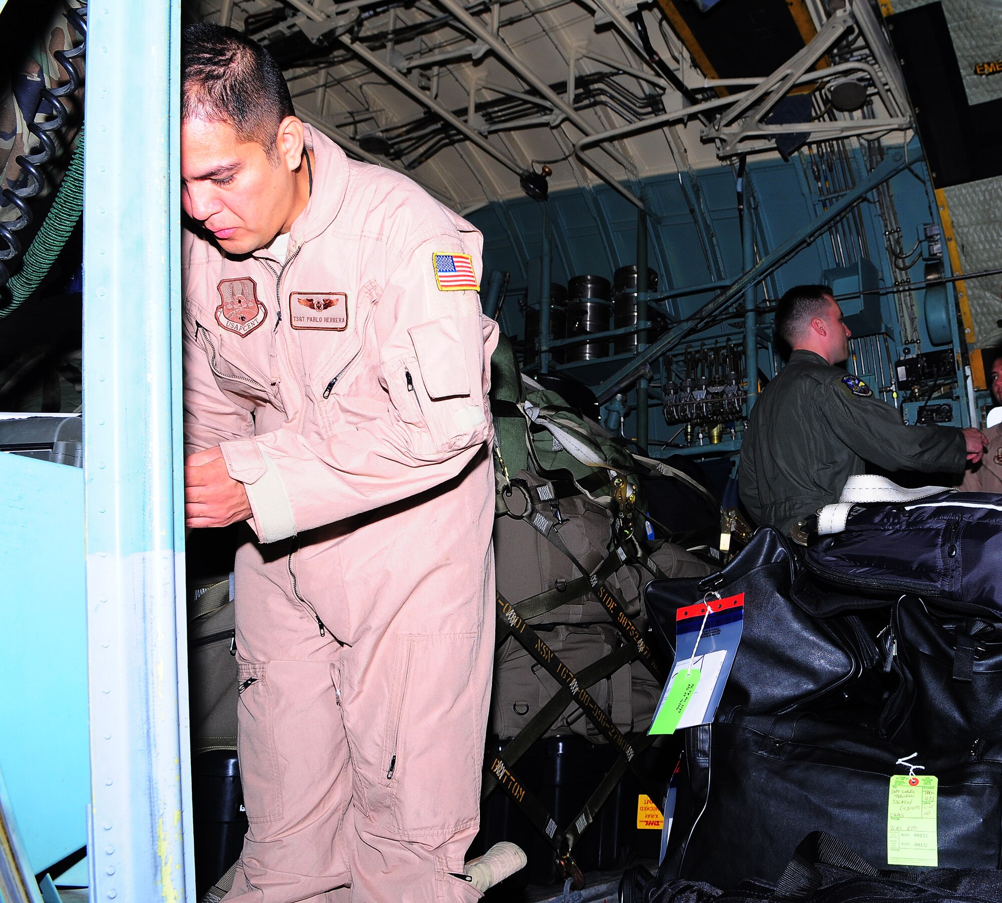 YOKOTA AIR BASE, Japan - Technical Sergeant Pablo Herrera, 36th Airlift Squadron loads his baggage onto a C-130 before departing for his deployment. The 36 AS held a sendoff Oct. 4 to show their support for the deploying members.(U.S. Air Force photo/Staff Sgt. Stacy Moless)