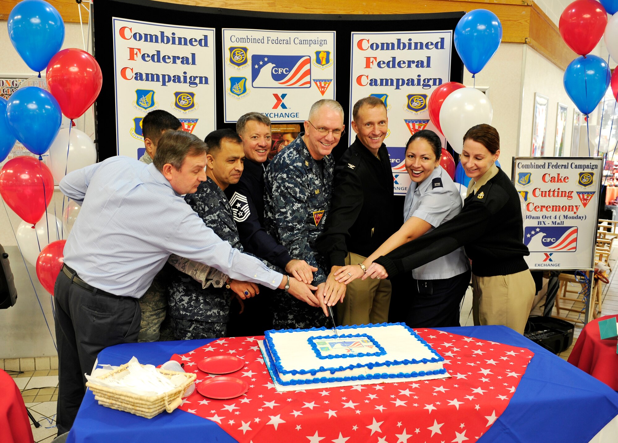 Misawa Air Base key leaders cut the ceremonial cake during the Combined Federal Campaign opening ceremony, Oct. 4, 2010, at Misawa Air Base, Japan. The campaign offers hundreds of national and international charitable organizations for people to sponsor. (U.S. Air Force photo by Staff Sgt. Chad C. Strohmeyer/Released)