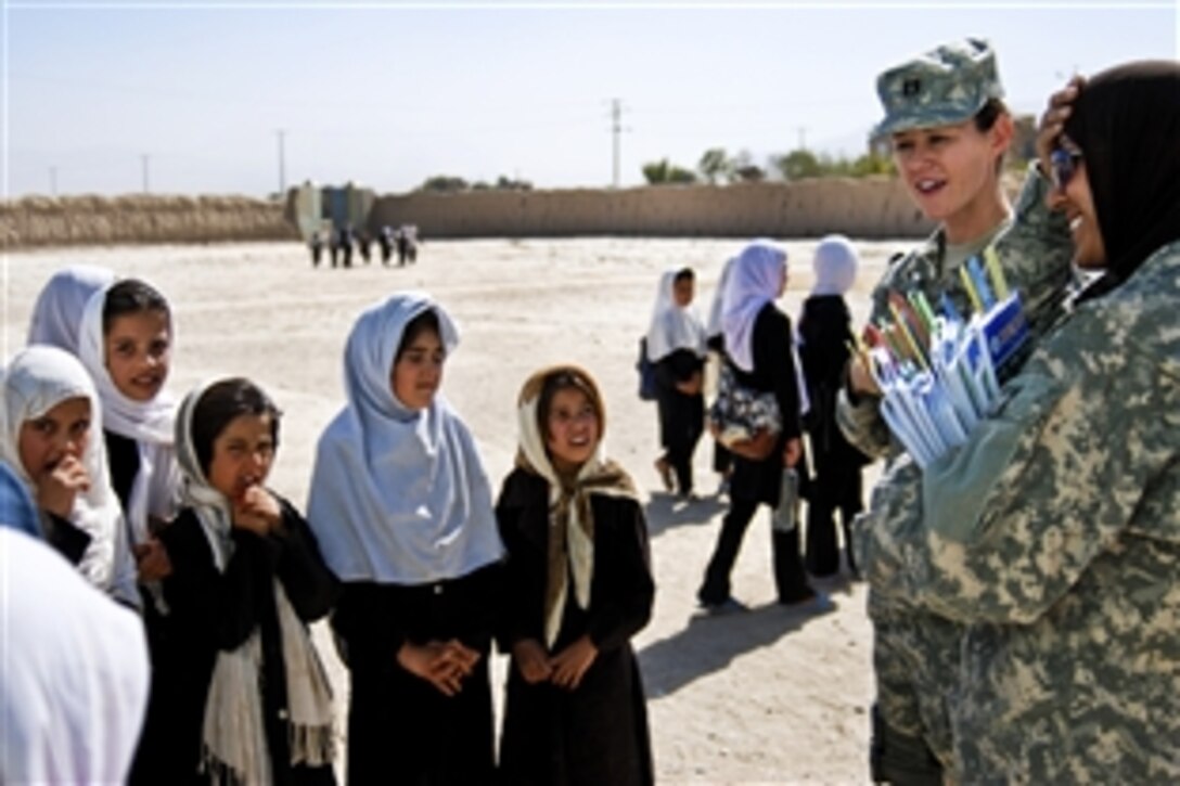 U.S. Army Capt. Lisa Kirby speaks with Kaka Kot school students to learn what they want to be 
when they grow up in the Nahr-e-Shahi district, Afghanistan, Oct. 4, 2010.The Afghan National Army's 209th Corps and the U.S. Army's 10th Mountain Division's Female Engagement Team donated about $3,000 worth of school supplies to the girls' school. Kirby is the team coordinator assigned to the 10th Mountain Division on Camp Mike Spann in northern Afghanistan.
