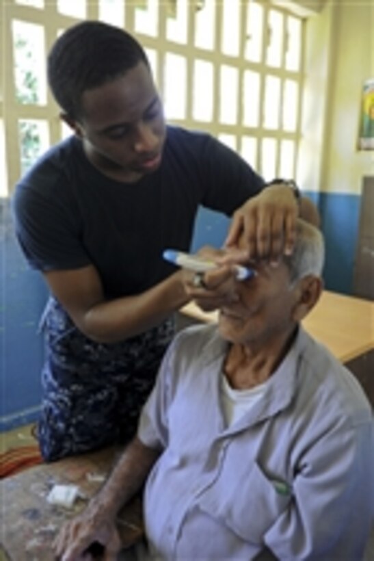 U.S. Navy Seaman Aaron London (left), assigned to the multipurpose amphibious assault ship USS Iwo Jima (LHD 7), checks a man's eye pressure during a screening at a Continuing Promise 2010 medical site in Chirique, Panama, on Sept. 28, 2010.  The ship is supporting Continuing Promise 2010, a humanitarian and civic assistance mission that provided medical, dental, veterinary and engineering assistance to the residents of the community.  