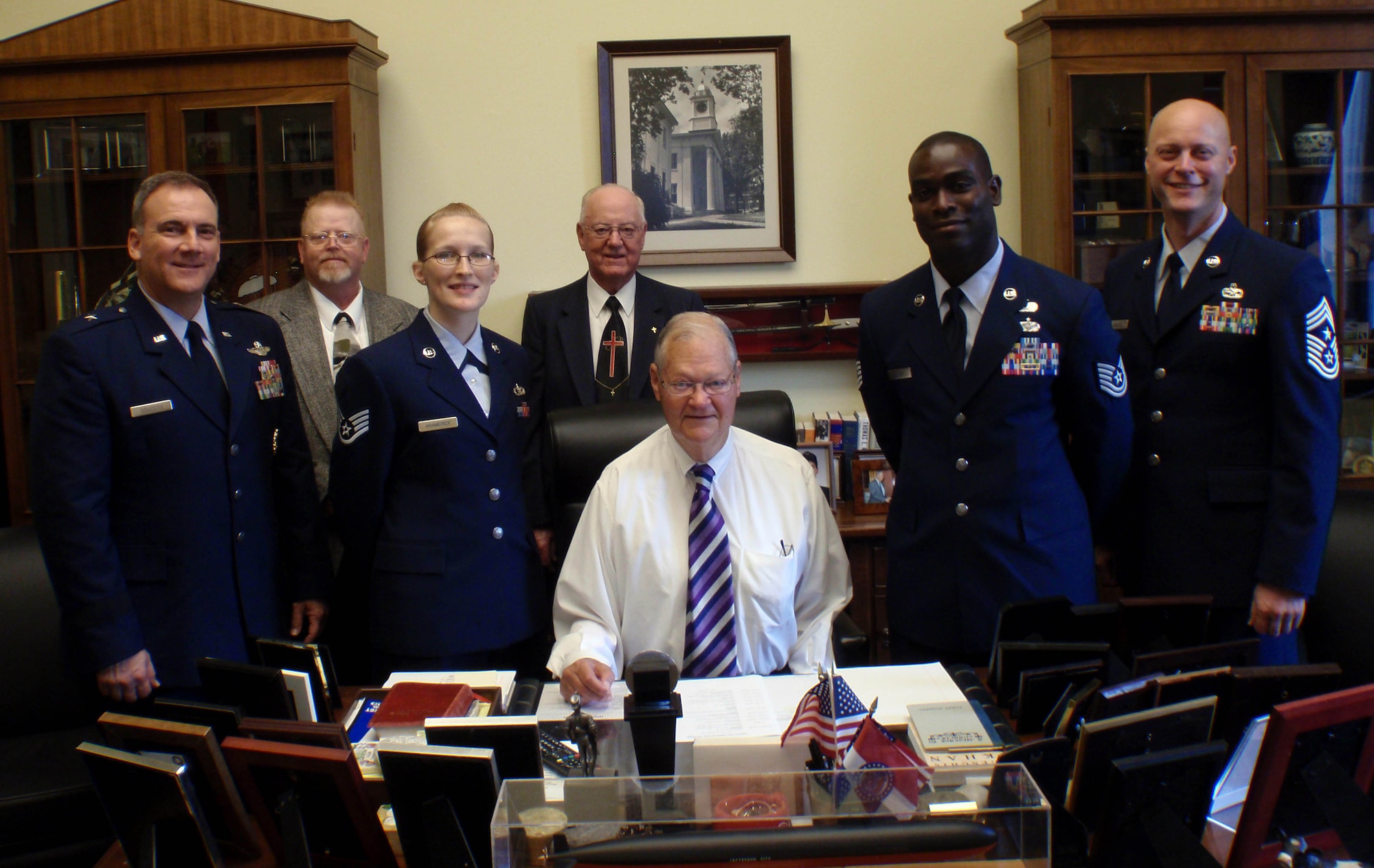 Brig. Gen. John Doucette, 36th Wing commander, and Chief Master Sgt. Allen Mullinex, 36th Wing command chief, Tech. Sgt. Ralph Oliver, 36th Judge Advocate NCO in-charge of military justice, and Staff. Sgt. Melissa Kramerick, 36th Operation Support Squadron weather forecaster, met with Missouri Congressman Ike Skelton, Chairman of the House Armed Services Committee during a visit to Capitol Hill in Washington, D.C. Sept. 28. (U.S. Air Force Courtesy Photo)