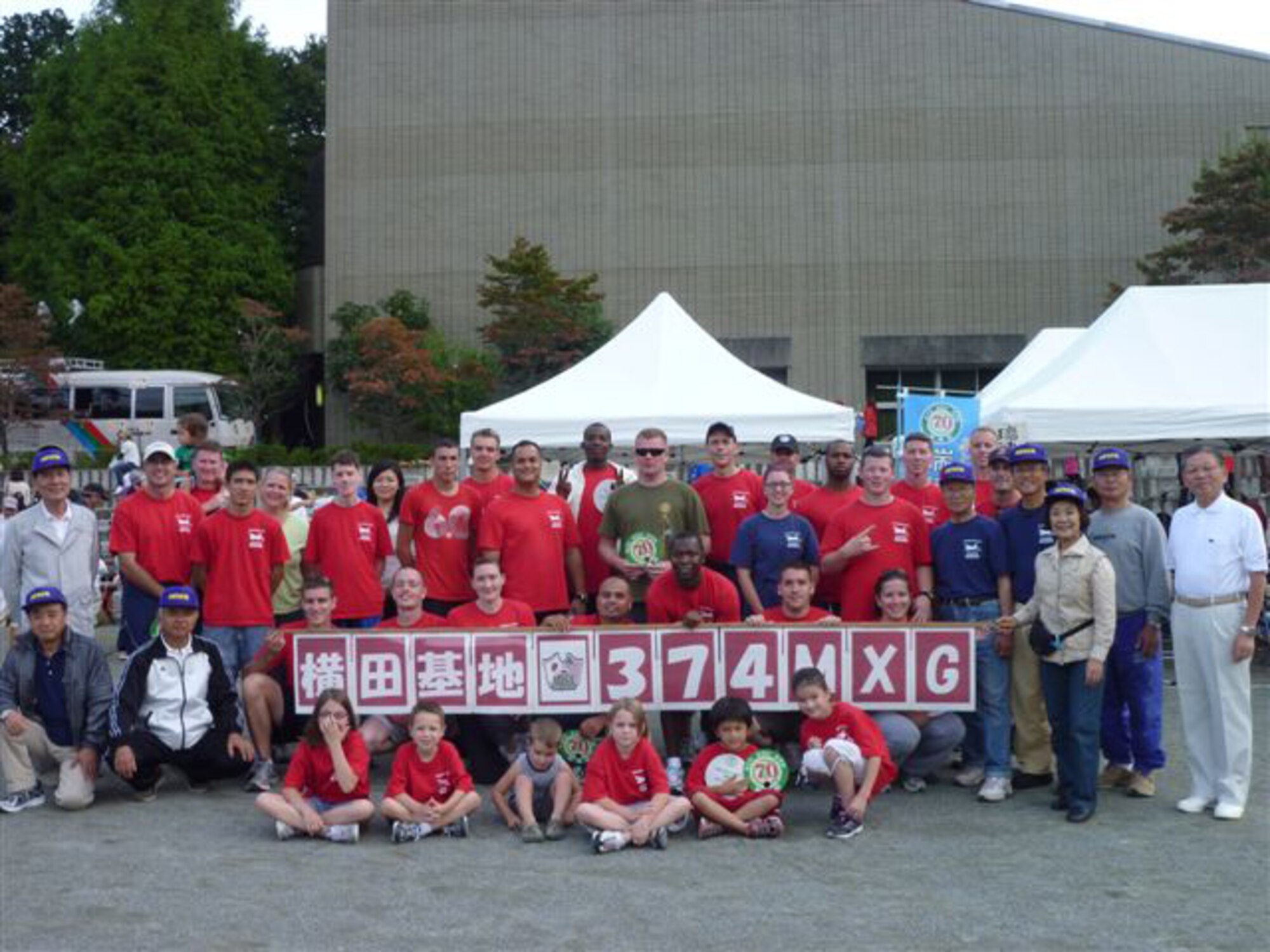 YOKOTA AIR BASE, Japan -- Members from the 374th Maintenance Group pose for a group picture with members of the Mizuho Friendship Association, Oct. 3.  More than 30 members from 374 MXG Participated in the 51st Mizuho Town Sports Day.(U.S. Air Force photo/Naoko Kurokui)
