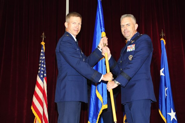 Brig. Gen. Scott Dennis, 7th Air Force vice commander, accepts the brigadier
general flag from Lt. Gen. Jeffrey  A. Remington, 7th Air Force commander,
during his promotion ceremony Sept. 20. (U.S. Air Force photo by Staff Sgt.
Eunique Stevens)
