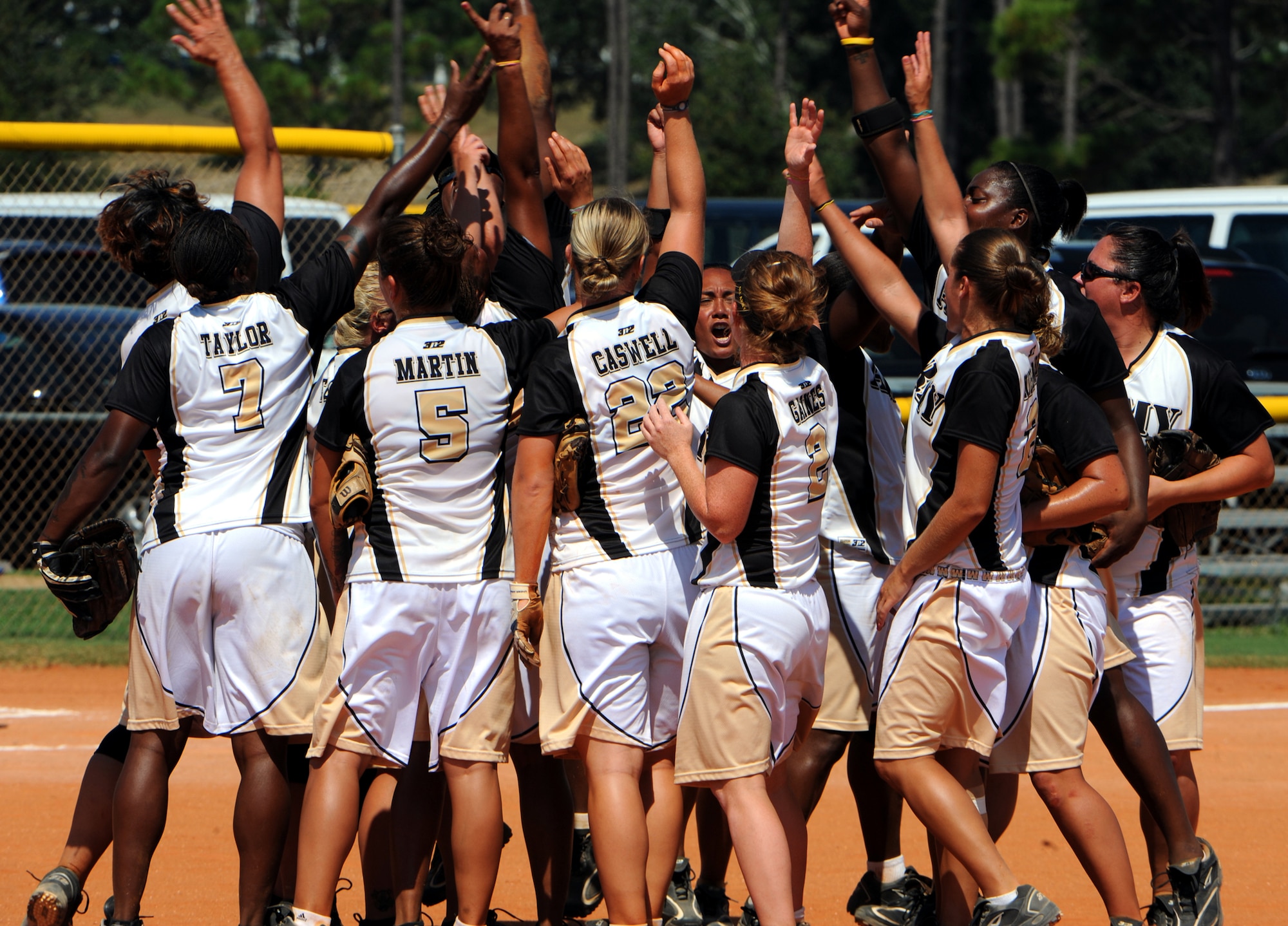 The All-Army Women’s Softball Team celebrates a gold-medal-clinching 7-3 victory over All-Air Force on Sept. 21 at the 2010 Armed Forces Softball Championships at Naval Air Station Pensacola, Fla. Sgt. Margaret Gaines (No. 2) is assigned to Joint Base Elmendorf-Richardson’s Troop Health Clinic. (U.S. Army photo/Tim Hipps)