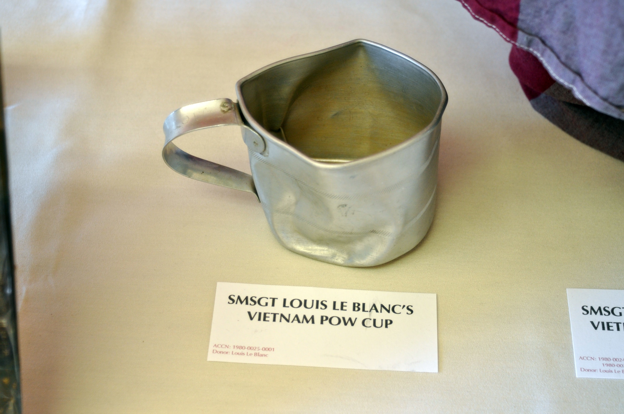 The March Field Museum created a special exhibit of POW/MIA artifacts which they displayed in the Cultural Resource Center lobby. One of the items on display was Senior Master Sgt. Louis Le Blanc’s Vietnam POW cup. (U.S. Air Force photo by Linda Welz)
