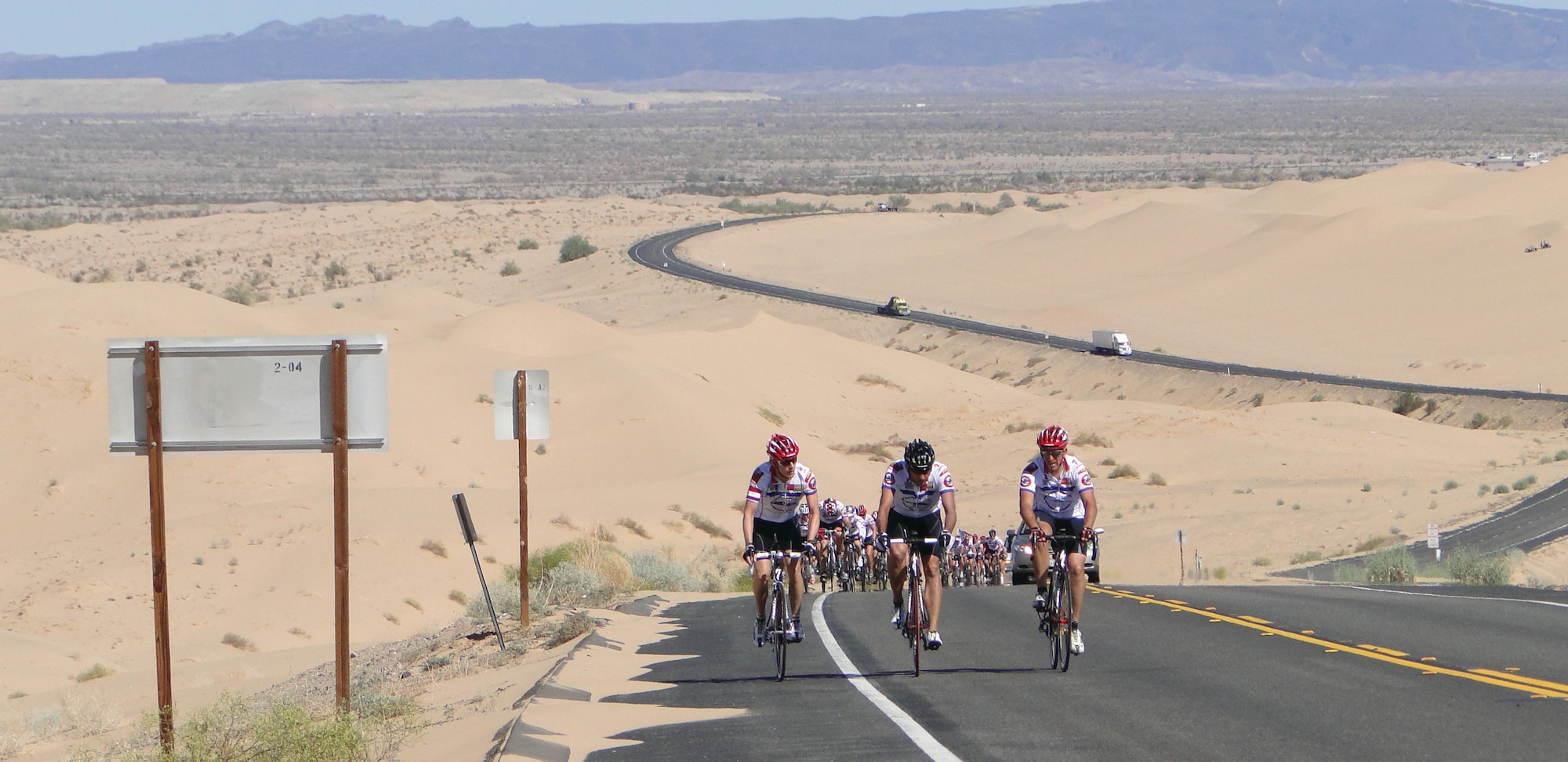 During the second day of the 2009 Ride for Semper Fi, cyclists push through the sand dunes just outside of Brawley, Calif.  Leading the pack are Arizona riders (from left) Simon Keeton, Phil Maxwell and Joe Liner.  Even on hills, the riders try to keep together as a group. Lt. Col. Paul Thompson, a C-17 Globemaster III pilot with the 729th Airlift Squadron at March Air Reserve Base, Calif., and John Greenway during founded the annual 430-mile ride to raise money for wounded warriors.  (Photo courtsey of The Ride for Semper Fi)