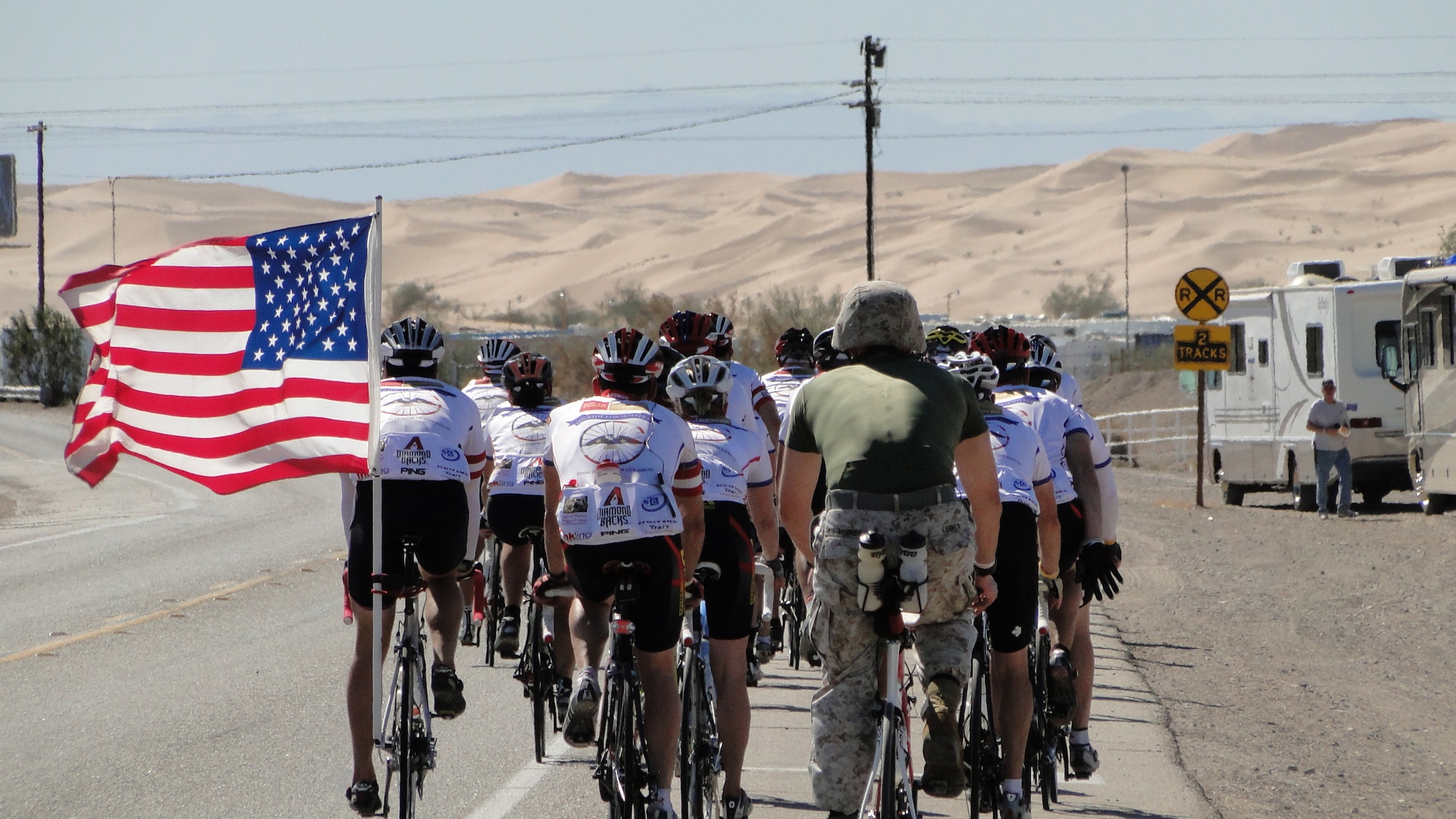 The Ride for Semper Fi leaves Brawley, Calif., Oct. 15, 2009.  Riding in uniform is Marine Corps Maj. William Conner.  Riding with the American flag is Bob Purcell of Mesa, Ariz. Lt. Col. Paul Thompson, a C-17 Globemaster III pilot with the 729th Airlift Squadron at March Air Reserve Base, Calif., and John Greenway during founded the annual 430-mile ride to raise money for wounded warriors.  (Photo courtsey of The Ride for Semper Fi)