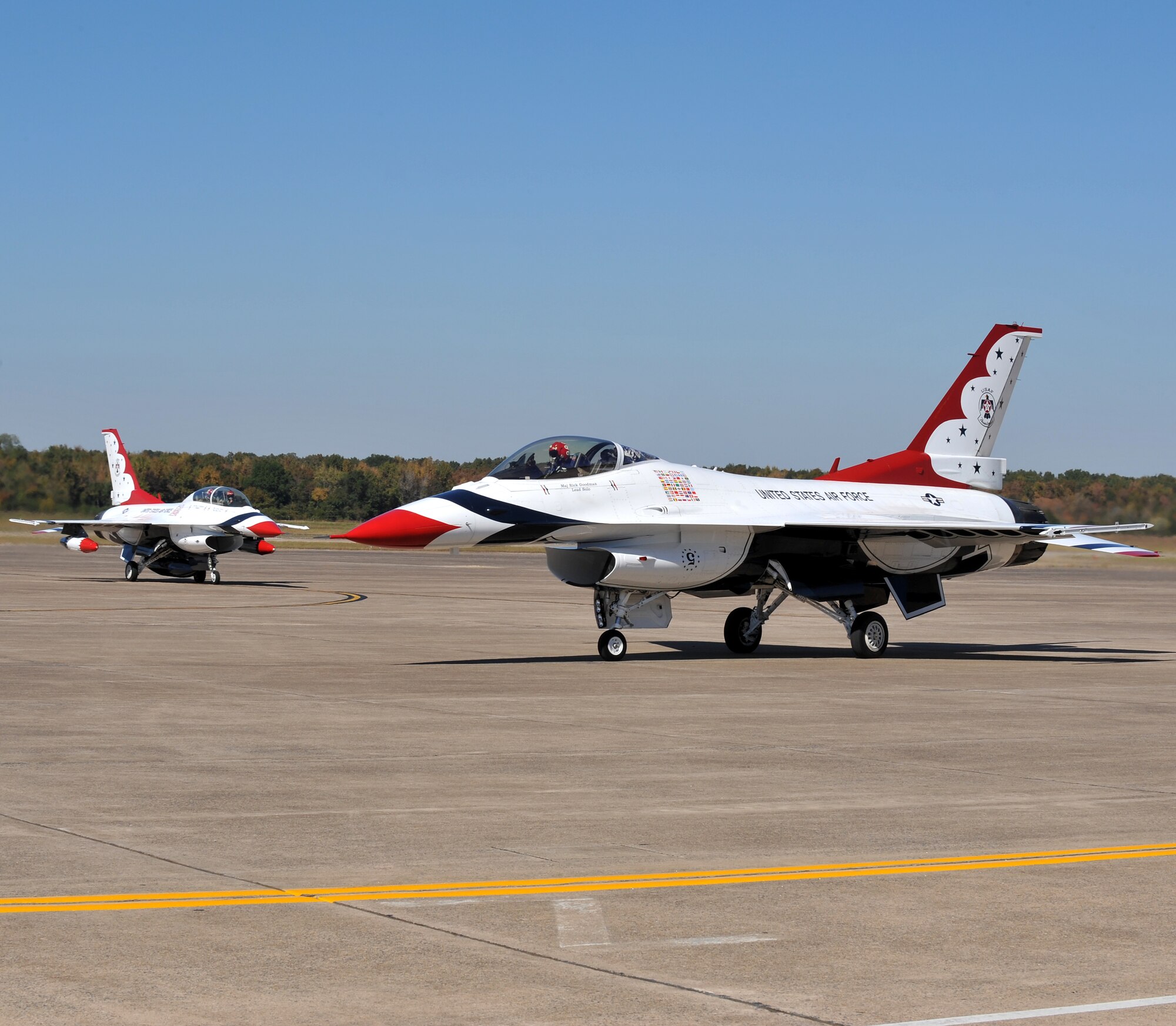 Maj. Rick Goodman, No. 5, and Capt. Kristin Hubbard, No. 8, both members of the Air Force Thunderbirds F-16 demonstration team, taxi in on the base runway Oct. 6. The Air Force Thunderbirds F-16 demonstration team is headlining the base’s air show Oct. 9-10.  (U.S. Air Force photo by Staff Sgt. Chris Willis)
