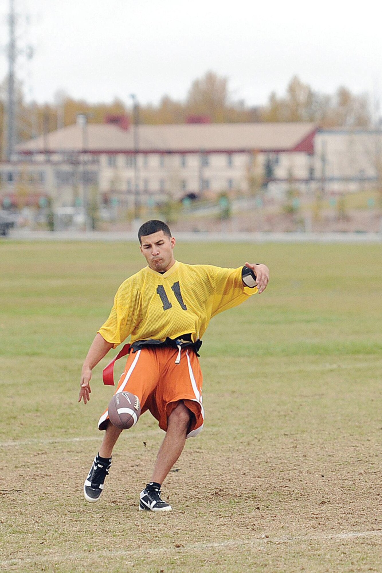 Richard Pantoja, 3rd EMS quarterback, punts the football in the first half of the JBER flag football championship game. Pantoja’s injury in the second half made it tough for the maintainers to catch the paratroopers. (U.S. Air Force photo/John Pennell)