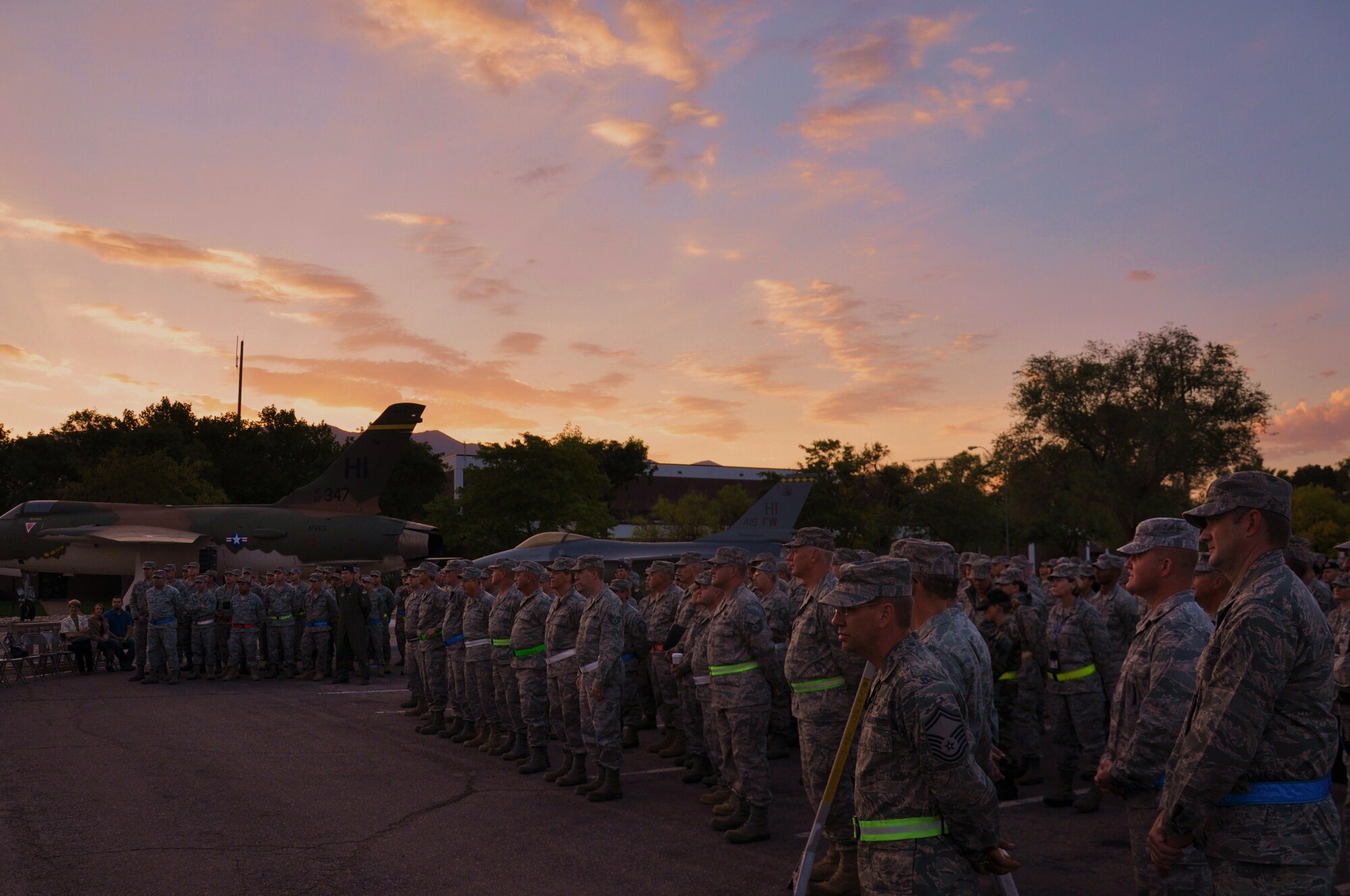 The sunrise paints the sky overhead as the 419th Fighter Wing is called to attention during the formal ceremony for Command Chief Master Sgt. Cindy George Oct. 3. (U.S. Air Force photo/Staff Sgt. Alan Schultz)