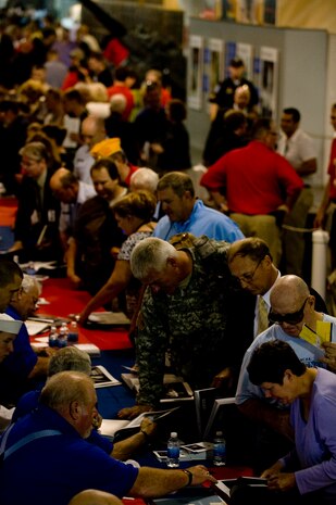 Visitors aboard the USS Yorktown at the Patriots Point Naval and Maritime Museum in Mount Pleasant, S.C., attend an autograph session by Medal of Honor recipients during the week of the Medal of Honor Convention held in Charleston, S.C, Sept. 30, 2010. The Medal of Honor Convention is an annual event hosted by a different city each year to honor Medal of Honor recipients as well as all service members who protect American freedoms. The 2010 Medal of Honor Convention was hosted by the South Carolina State Guard Foundation and The Citadel, the military college of South Carolina. Fifty-five of the 87 living recipients attended this year's convention. (U.S. Air Force photo/Tech. Sgt. Adrian Cadiz)
