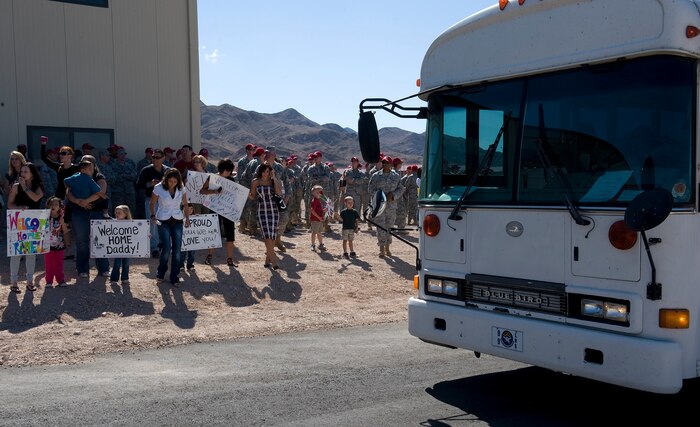 NELLIS AIR FORCE BASE, Nev. -- Friends and family of 820th RED HORSE Squadron members wait for the return of deployed Airmen Oct. 5th. Members of the 820th RHS were deployed to Afghanistan for six months for engineering support. (U.S. Air Force photo by Senior Airman Brett Clashman)