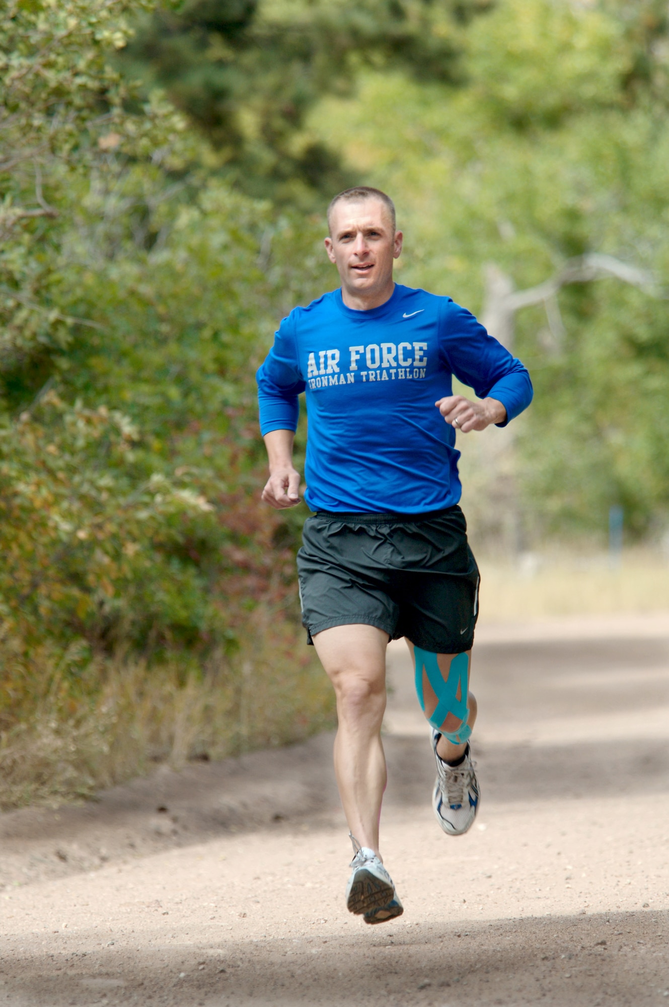 Maj. Scott Poteet, the adviser for Air Force Academy Cadet Squadron 02, trains for the 2010 Ironman Triathlon Oct. 4, 2010 at the Academy. Poteet's regimen includes more than three hours of training per day biking, swimming and running. The Ironman Triathlon takes place Oct. 9 in Kona, Hawaii. (U.S. Air Force photo/Staff Sgt. Raymond Hoy)
