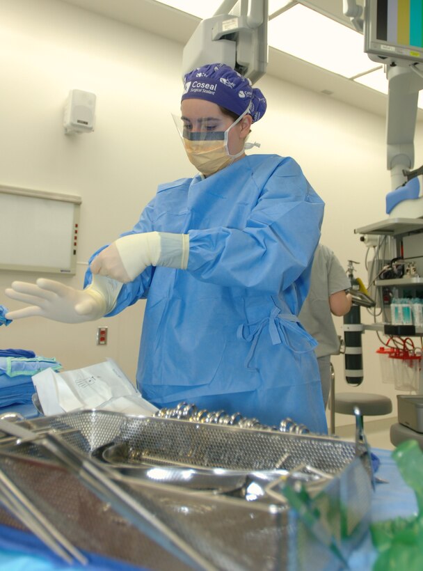 LANGLEY AIR FORCE BASE, Va. -- Airman 1st Class Krystal Woolverton, 633d Surgical Operations Squadron surgical technologists, prepares the surgical field prior to a surgery at the Langley hospital Oct. 5. The 633d Medical Group employs 22 surgical technologists, boasting a combined experience of more than 50 years. (U.S. Air Force photo/Airman 1st Class Jason J. Brown) (RELEASED)