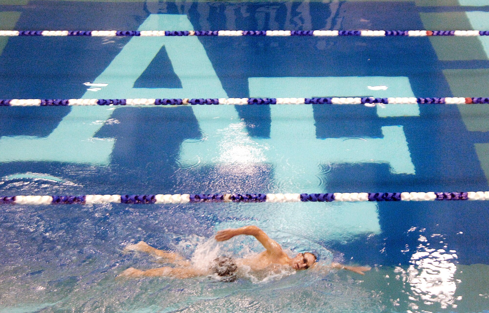 Maj. Scott Poteet, the adviser for Air Force Academy Cadet Squadron 02, trains for the 2010 Ironman Triathlon Oct. 4, 2010 at the Academy. Poteet's regimen includes more than three hours of training per day biking, swimming and running. The Ironman Triathlon takes place Oct. 9 in Kona, Hawaii. (U.S. Air Force photo/Staff Sgt. Raymond Hoy)