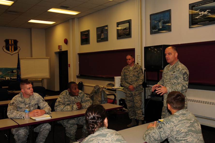 Chief Master Sgt. Dwight Badgett, Air Force Reserve Command command chief, speaks with newcomer Airmen between their orientation briefings welcoming them to the installation, and in some cases, the Air Force. Chief Badgett visited Niagara Air Reserve Station during the October Unit Training Assembly as part of his commitment to visit 36 installations over 36 months. During his visit, the chief visited Airmen from nearly every unit, speaking about important elements of being an Air Force reservist and asking for anyone to present questions, concerns or advice to take back to command. (Air Force photo/Senior Airman Jessica Snow)