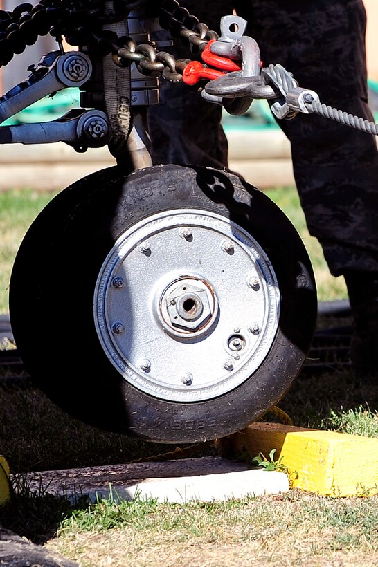 ELLSWORTH AFB, S.D. - Airmen of the 28th Maintenance Squadron repair and reclamation section use crash recovery equipment to lift an F-100A Super Sabre, Sept 27.  The 28th Maintenance Squadron repair and reclamation section is responsible for crash recovery; they manage clean-up efforts in the event of an aircraft incident on the airfield. (U.S. Air Force photo/Staff Sgt. Marc I. Lane)