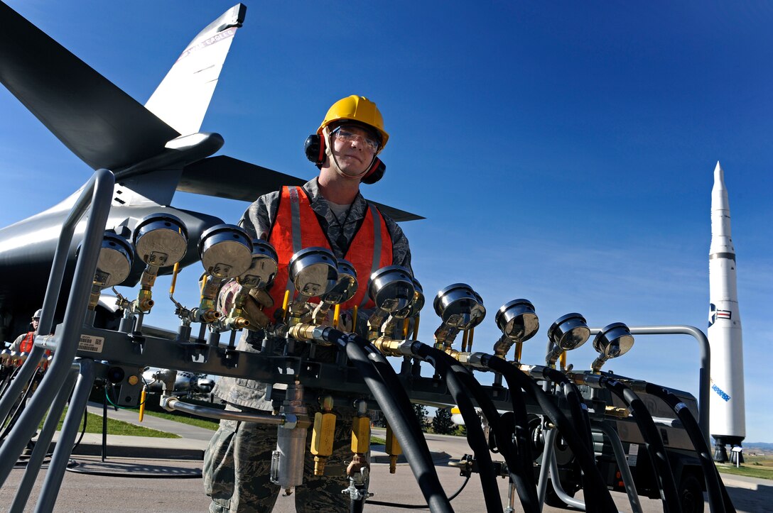 ELLSWORTH AFB, S.D. - Tech. Sgt. Zachary Renner, 372nd Training Squadron Detachment 8 instructor, opens a valve on a pneumatic manifold to purge an air hose, Sept. 27.  The hose must be purged to ensure it is clear of debris before connected to a pneumatic air bag. The 28th Maintenance Squadron repair and reclamation section is responsible for crash recovery; they manage clean-up efforts in the event of an aircraft incident on the airfield. (U.S. Air Force photo/Staff Sgt. Marc I. Lane)