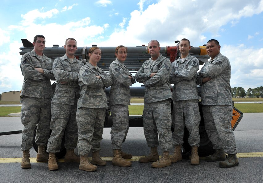 101004-F-4406D-014 SHAW AIR FORCE BASE, S.C.--    (From left to right) Staff Sgt. Patrick Stehley, Staff Sgt. Brian Parker, Staff Sgt. Cari Gardner, Staff Sgt. Luanna Holley, Staff Sgt. Nathan DeGregory, Staff Sgt. Jonathan Farmer and Staff Sgt. Juan Borja, 20 Equipment Maintenance Squadron precision guided munitions crew chiefs, stand in front of a trailer of Air Intercept Missiles Oct. 4, 2010. The ammo shop plays a key role in ensuring missiles are built, pre-inspected and accounted for before they are loaded on trailers and delivered to the flight line. (U.S. Air Force photo/ Airman 1st Class Tabatha L. Duarte(Released)