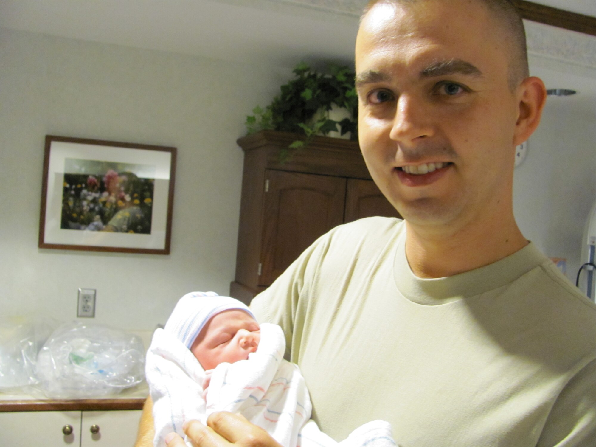 Sergeant Kemp with his new daughter Isabella. (Courtesy photo)