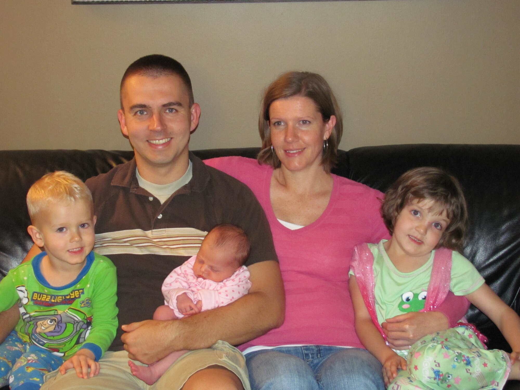 Eli, Sergeant Kemp, Isabella, Natalie and Abby Kemp relax at home. (Courtesy photo)