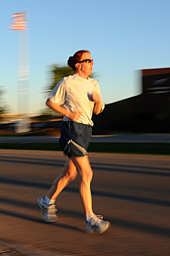 ELLSWORTH AFB, S.D. – Tech. Sgt. Sheryl Kelly, 28th Munitions Squadron munitions inspection NCO in-charge, runs by the 28th Bomb Wing Headquarters Building during the 2nd Annual POW/MIA Remembrance 5k Run, Oct. 1. More than 400 participated in the run. (U.S. Air Force photo/Senior Airman Kasey Close)