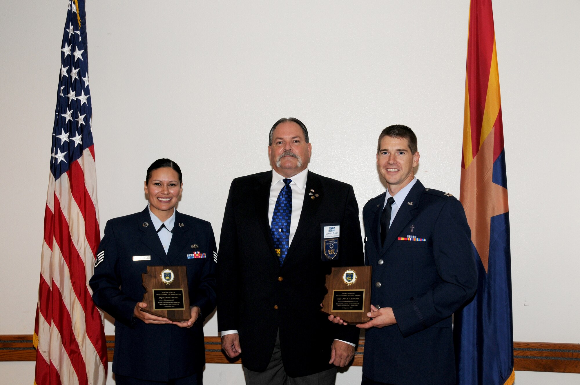 Tech. Sgt. Cynthia Islava (left) and Capt. Lance Schrader (right) are shown with Tempe Military Affairs Committee member Don Bliven after the presentation of awards September 15, 2010. (U.S. Air Force photo/Master Sgt. Kelly Deitloff) 