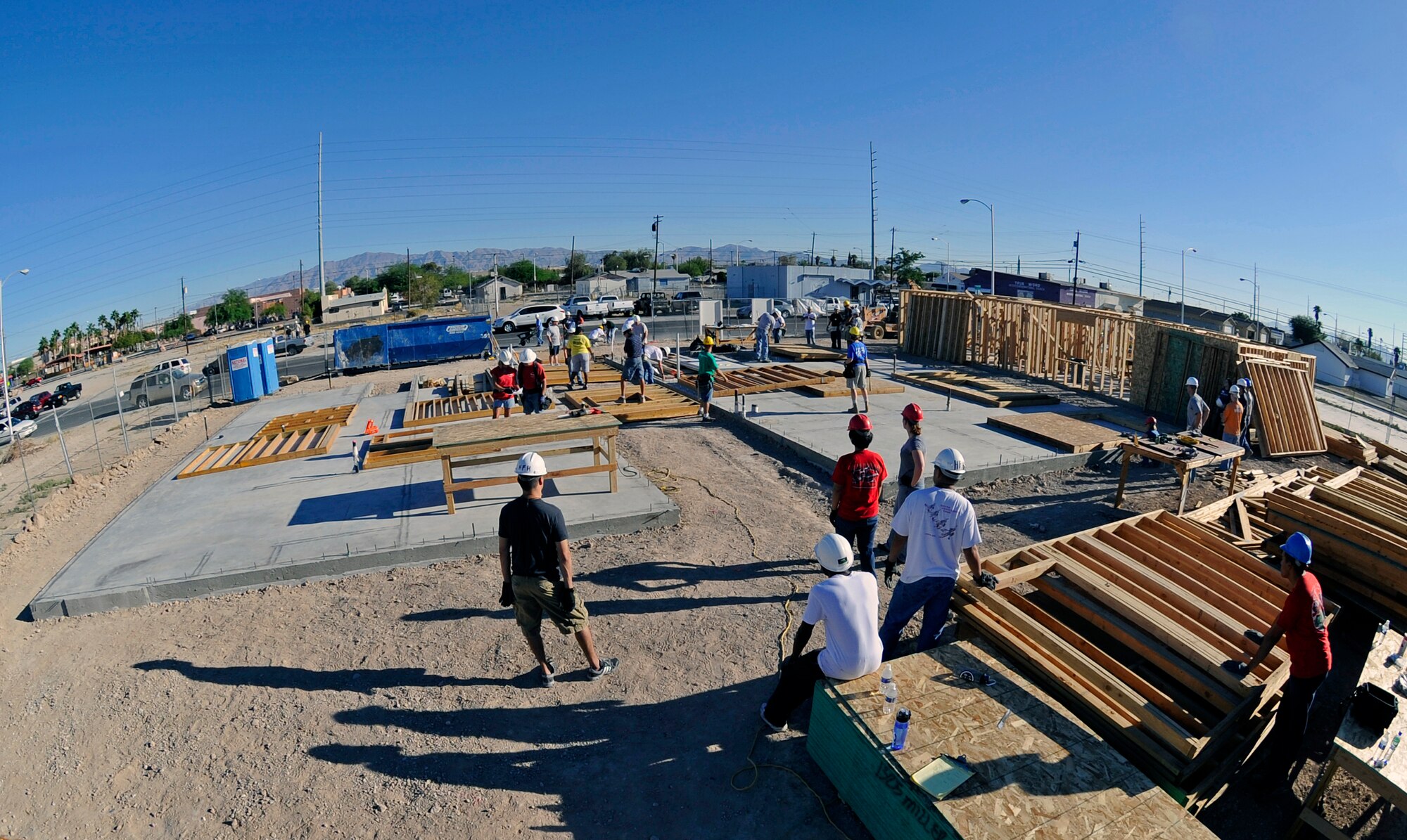 LAS VEGAS -- Personnel from Creech AFB arrange wall frames for three houses during a Creech Top Three sponsored Habitat for Humanity event in Las Vegas Sept. 18. Habitat for Humanity uses volunteers and donations to build houses which are sold for no profit to those in need. (U.S. Air Force Photo)