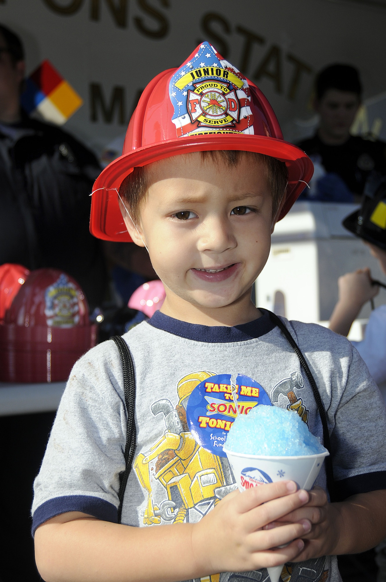 Four-year-old Mason Bauerbach enjoys a free Sno-cone provided by Weapons Station firefighters at the fire prevention fair held in recognition of National Fire Prevention Week, onboard Joint Base Charleston-WS, S.C., Oct. 5, 2010. The event stressed the importance of fire safety and increasing awareness in the Charleston area. (U.S. Navy photo by Mass Communication Specialist 1st Class Jennifer R. Hudson/released)