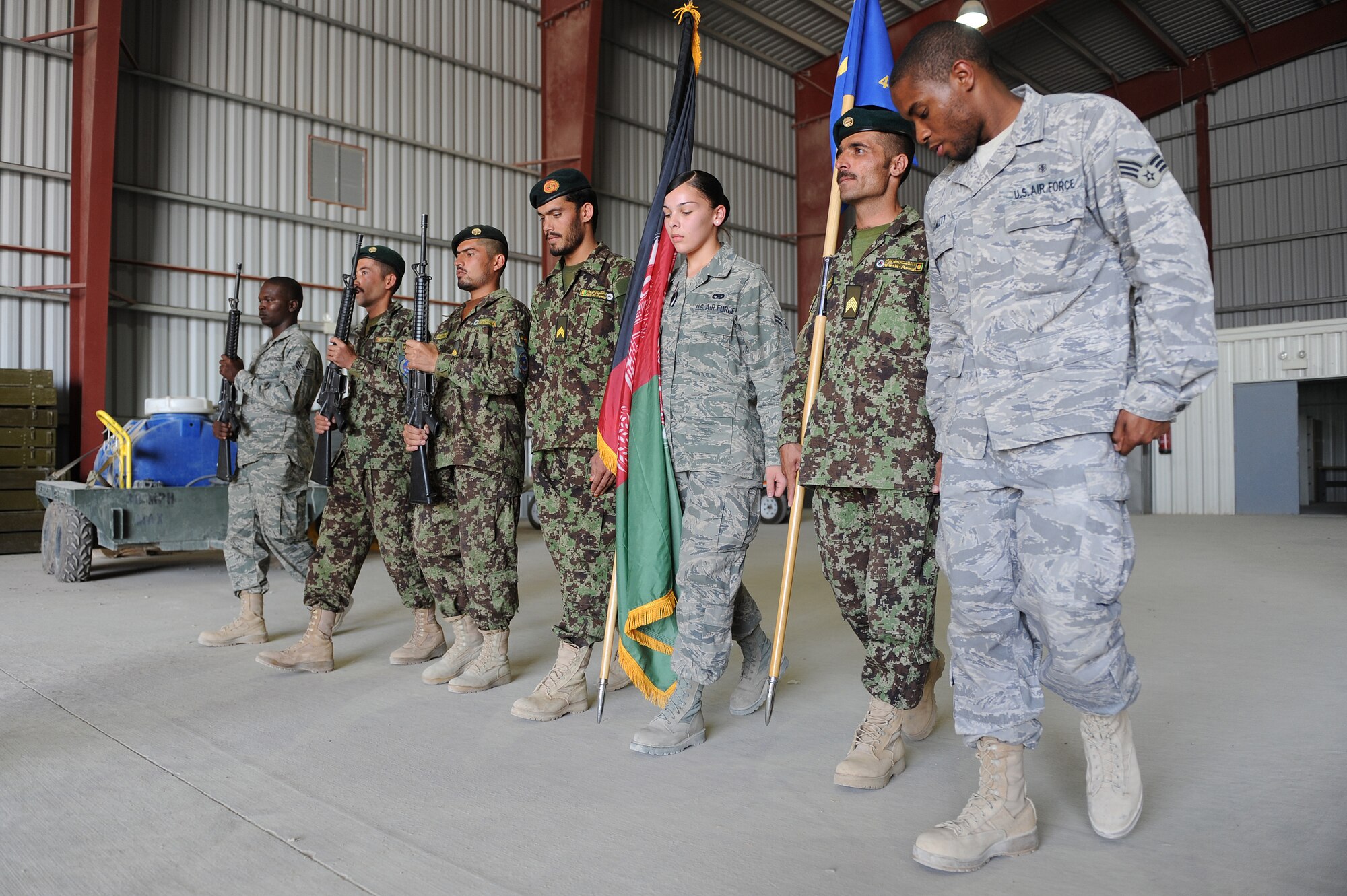 Airmen from the 451st Air Expeditionary Wing Honor Guard and Afghan Airmen practice marching Oct. 3, 2010, at Kandahar Airfield, Afghanistan. The 451st AEW Honor Guard worked with the Afghans to help them prepare their own Honor Guard for a ceremony marking the one year anniversary of the Kandahar Air Wing.  (U.S. Air Force photo by Tech. Sgt. Chad Chisholm/Released)