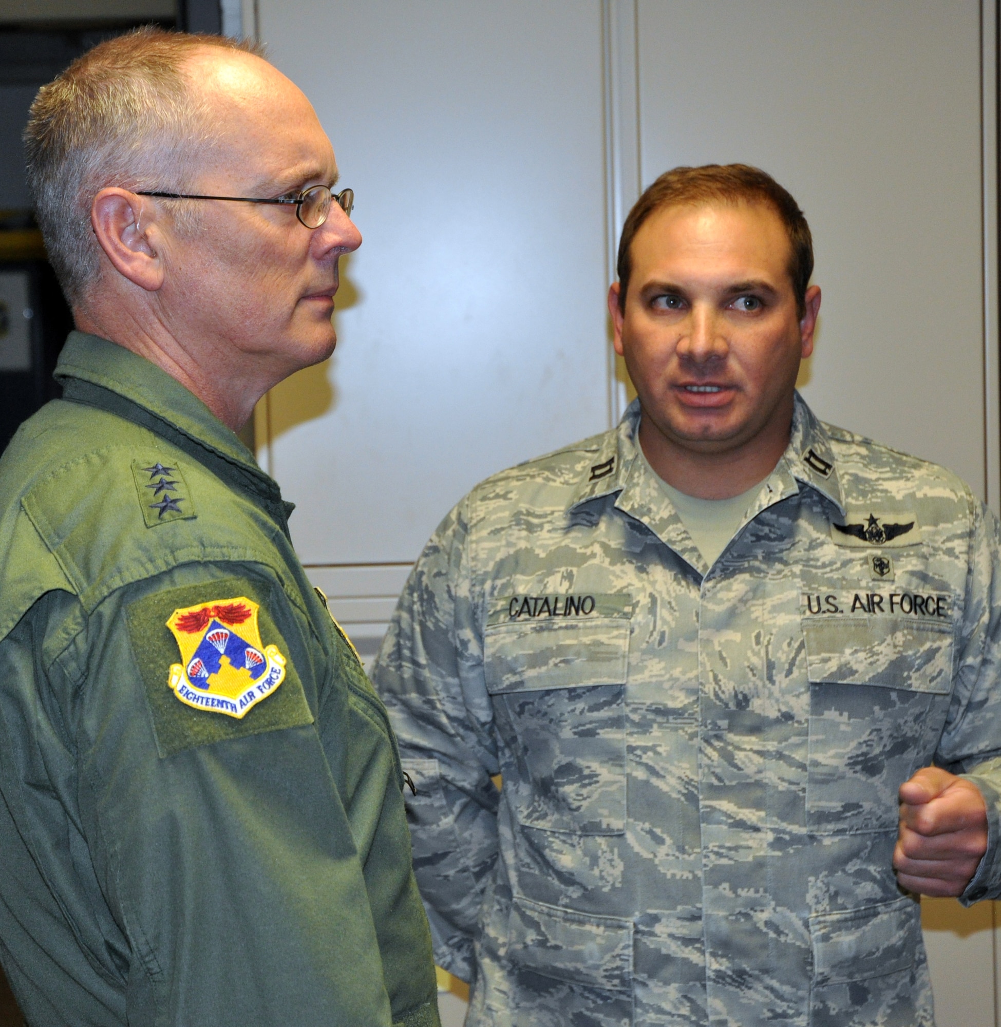 Lt. Gen. Robert Allardice, 18th Air Force commander (left) meets with Capt. Joseph Catalino during the general's Oct. 3 visit to the 302nd Airlift Wing at Peterson Air Force Base, Colo. The general's visit allowed for a better insight into how the wing's Total Force Integration is executed during an Air Force Reserve duty weekend. Captain Catalino is the director of operations for the 34th Aeromedical Evacuation Squadron. (U.S. Air Force photo/Tech. Sgt. Daniel Butterfield)