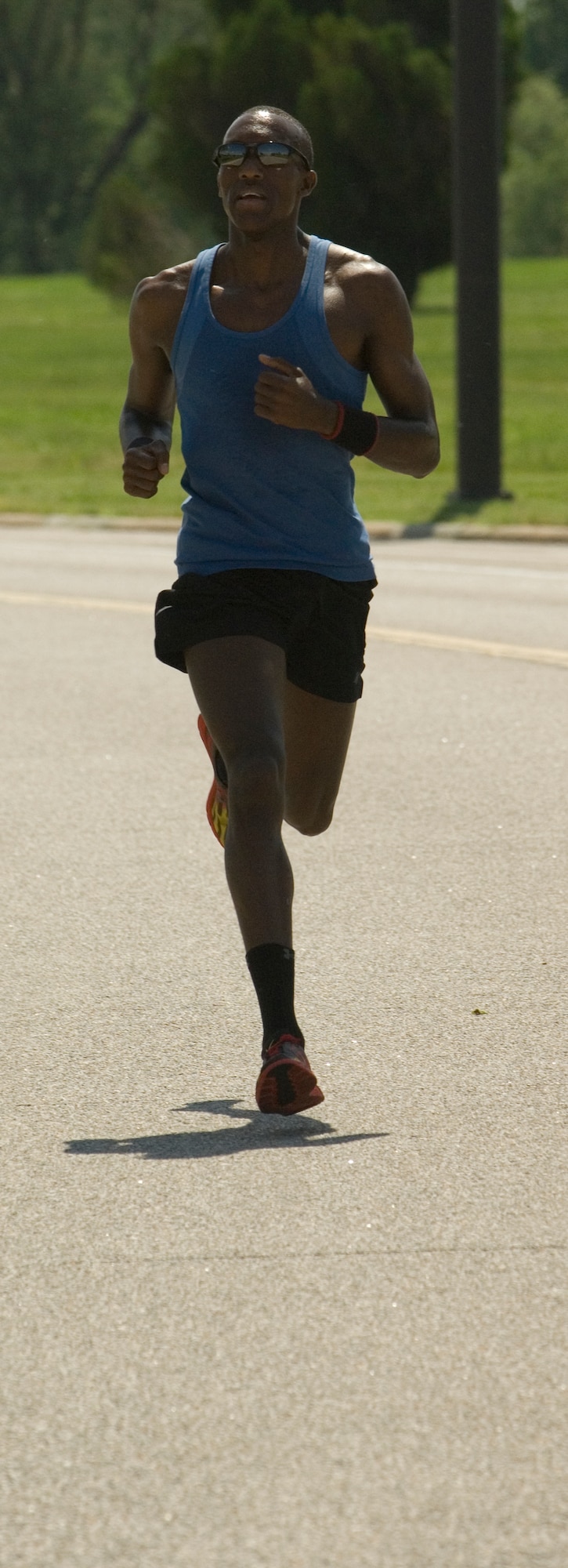 Airman 1st Class Moses Tum, 22nd Comptroller Squadron customer service technician, pulls away from competitors during a 5k run May 22, 2010, McConnell Air Force Base, Kan. Airman Tum recently broke the Wichita Rosstoberfest 5K course record with a time of 15 minutes, 13 seconds. He has ran his mile and a half in 6:56, setting a new McConnell Air Force Base record. (U.S. Air Force photo/Airman 1st Class Armando A. Schwier-Morales)  