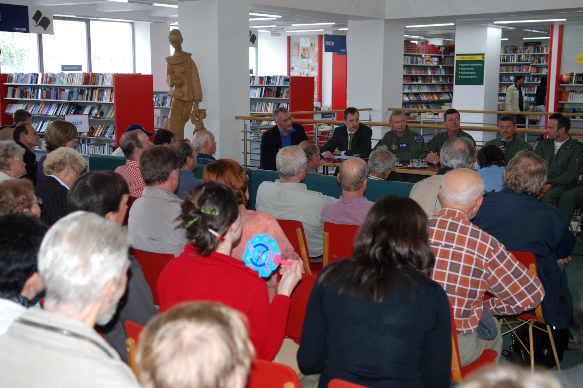 An aircrew from the 93rd Bomb Squadron at Barksdale Air Force Base, La., visits a local bookstore for a questions and answers session in Ostrava, Czech Republic, Sept. 17, 2010. The aircrew and support personnel made history when B-52H Stratofortress from the 917th Wing landed at the Leoš Janácek Airport in support of 10th Annual NATO Days in Ostrava air show, which is the largest air, army and security show in Central Europe. This marked the first-time a B-52 Stratofortress has visited the Czech Republic. (U.S. Air Force photo/Master Sgt. Greg Steele) 