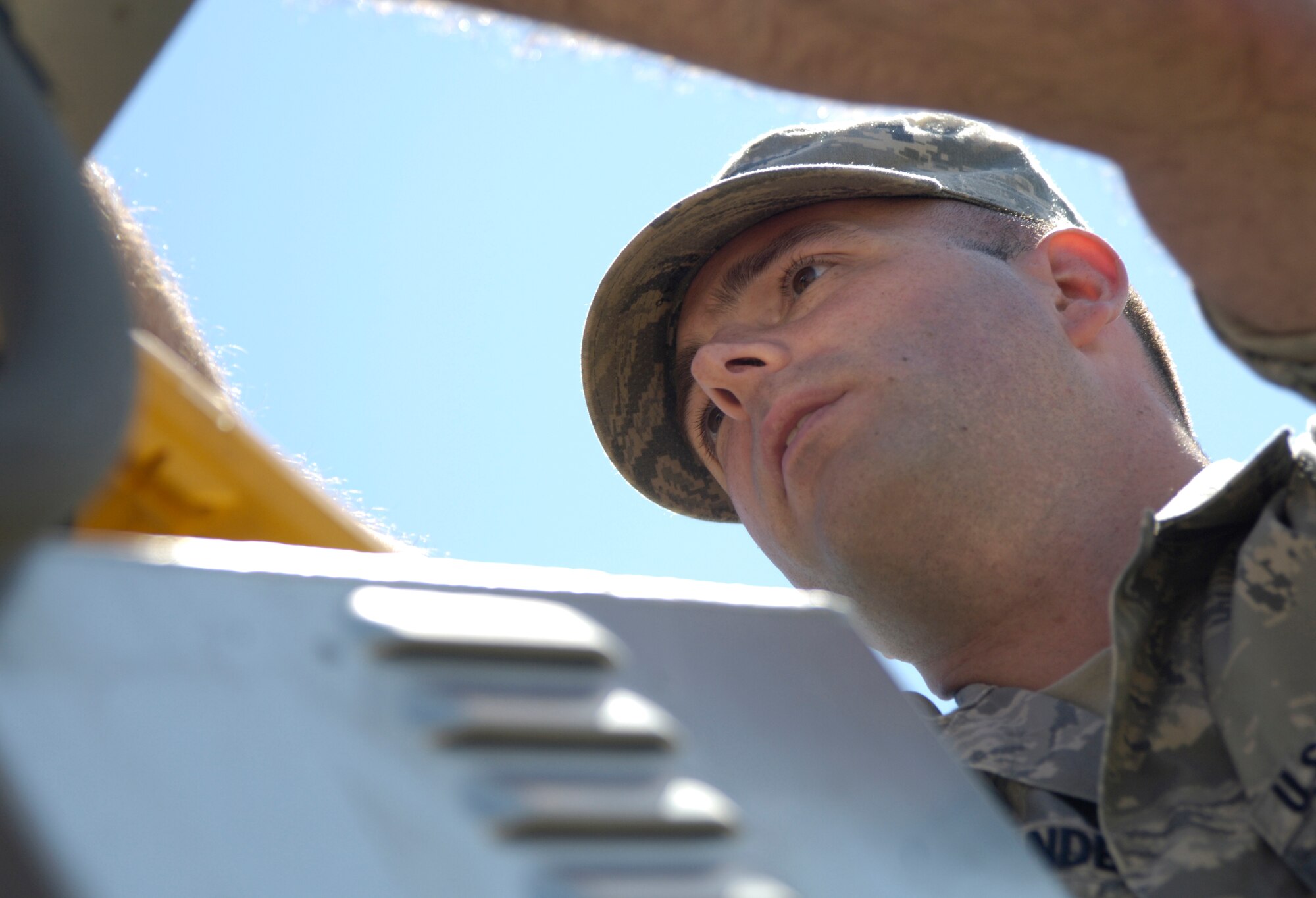 Airman 1st Class Michael Persondek, 22nd Communications Squadron radio frequencies transmissions systems technician, performs a voltage check Oct. 5, 2010, McConnell Air Force Base, Kan. Airman Persondek is currently assigned to the base honor guard where he performs ceremonial duties within 86 counties in Kansas and two counties in Oklahoma. The Garden City, Mich., native also maintains and monitors the base mass notification systems.(U.S. Air Force photo/Airman 1st Class Armando A. Schwier-Morales)