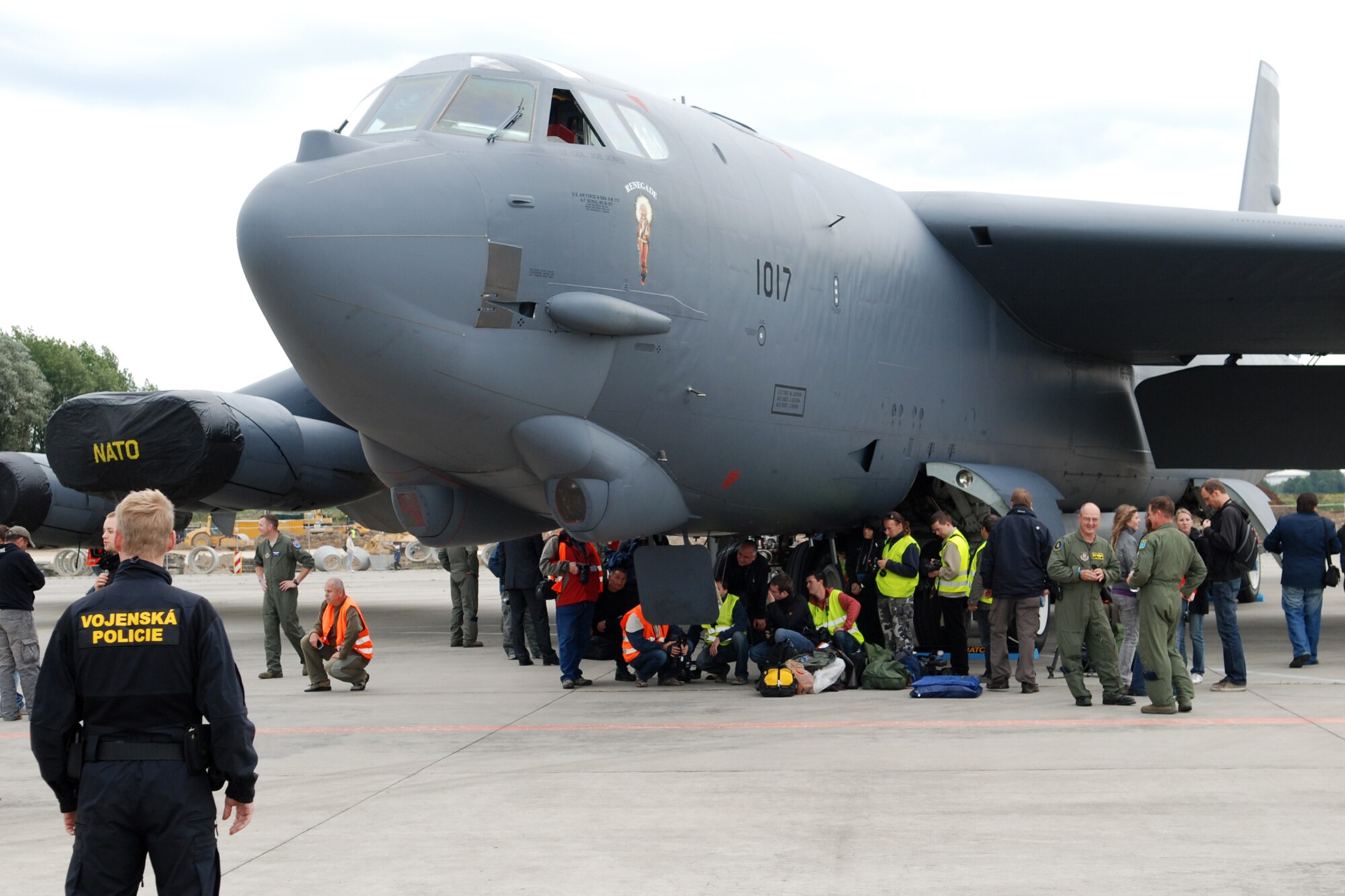 A Czech Republic policeman stands guard as anxious spectators, local and international media are allowed to get up close and personal with a 917th Wing B-52H Stratorfortress after its arrival at the Leoš Janácek Airport in Ostrava, Czech Republic, on Sept. 15, 2010. This marked the first-time a B-52 bomber visited the Czech Republic. It was flown there to support the 10th Annual NATO Days in Ostrava air show which is the largest air, army and security show in Central Europe. The 917th Wing is located at Barksdale Air Force Base, La. (U.S. Air Force photo/Master Sgt. Greg Steele) 