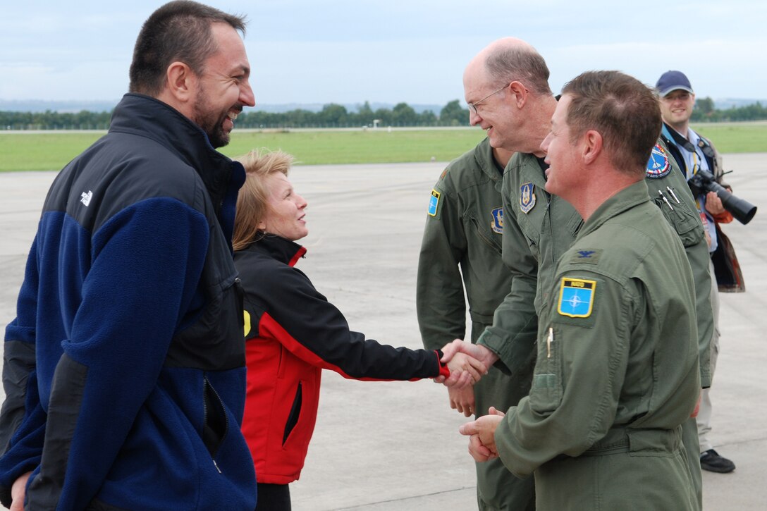 Zbynek Pavlacik, chairman of the Jagello 2000, and Beata Bulawa, Jagellow 2000 project manager, greet Colonel Keith Schultz, 917th Operations Group commander, and Lt. Col. Bruce Gootee, 93rd Bomb Squadron, director of operations, after their arrival in a 917th Wing B-52H Stratofortress at the Leoš Janácek Airport in Ostrava, Czech Republic, on Sept. 15, 2010. This marked the first-time a B-52 bomber has visited the Czech Republic. It was flown there to support the 10th Annual NATO Days in Ostrava air show, which is the largest air, army and security show in Central Europe. The Jagello 2000 is an association for euro-atlantic cooperation and is the main organizer of the air show. The 917th Wing is located at Barksdale Air Force Base, La. (U.S. Air Force photo/Master Sgt. Greg Steele) 