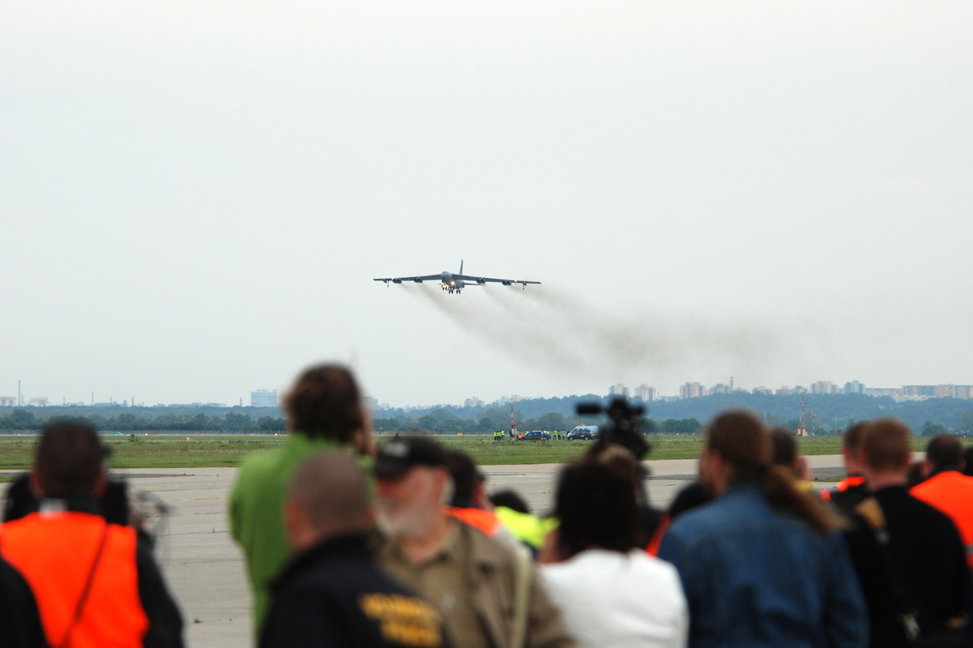 Spectators, local and international media, watch as a 917th Wing B-52H Stratofortress makes a wheels-down flyby over the Leoš Janácek Airport in Ostrava, Czech Republic, on Sept. 15, 2010. This marked the first-time a B-52 bomber has visited the Czech Republic. It was flown there to support the 10th Annual NATO Days in Ostrava air show, which is the largest air, army and security show in Central Europe. The 917th Wing is located at Barksdale Air Force Base, La. (U.S. Air Force photo/Master Sgt. Greg Steele) 