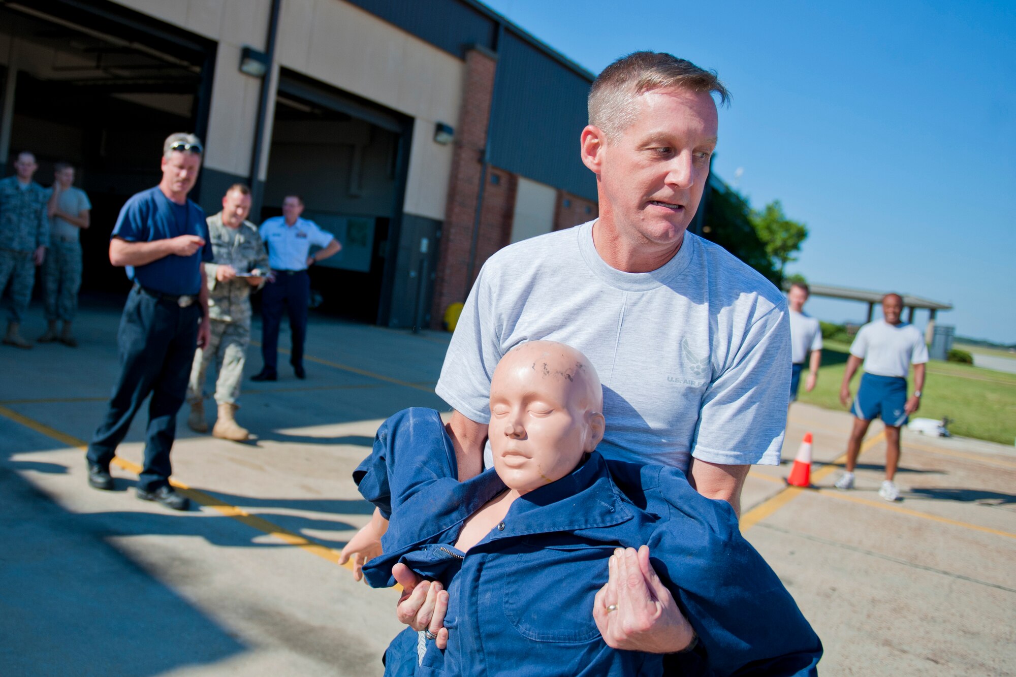 MOODY AIR FORCE BASE, Ga. -- Col. Mark Koppen, 23rd Medical Group commander, competes in a rescue-dummy drill during the annual Fire Prevention Week Fire Muster Oct. 4 at the 23rd Civil Engineer Squadron fire station. The event kicked off Fire Prevention Week, a week the 23rd CES dedicates to educating the base populace on fire hazards and safe practices. (U.S. Air Force photo/Senior Airman Jamal D. Sutter)