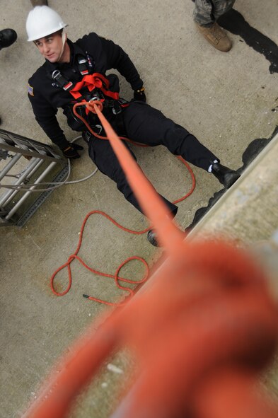 U.S. Air Force firefighters from the 180th Fighter Wing rappel down the side of a training facility at the Toledo Fire and Rescue Department Training Academy, October 5, 2010.  Firefighters from the 180th Fighter Wing are participating in six days of training designed to prepare them for various rescue situations. (U.S. Air Force photo by Senior Airman Amber Williams/Released)