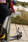 U.S. Air Force Airman 1st Class Devin VanGorder a firefighter with the 180th Fighter Wing rappels down the side of a training facility at the Toledo Fire and Rescue Department Training Academy, October 5, 2010.  Firefighters from the 180th Fighter Wing are participating in six days of training designed to prepare them for various rescue situations. (U.S. Air Force photo by Senior Airman Amber Williams/Released)