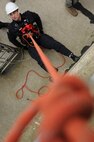U.S. Air Force firefighters from the 180th Fighter Wing rappel down the side of a training facility at the Toledo Fire and Rescue Department Training Academy, October 5, 2010.  Firefighters from the 180th Fighter Wing are participating in six days of training designed to prepare them for various rescue situations. (U.S. Air Force photo by Senior Airman Amber Williams/Released)