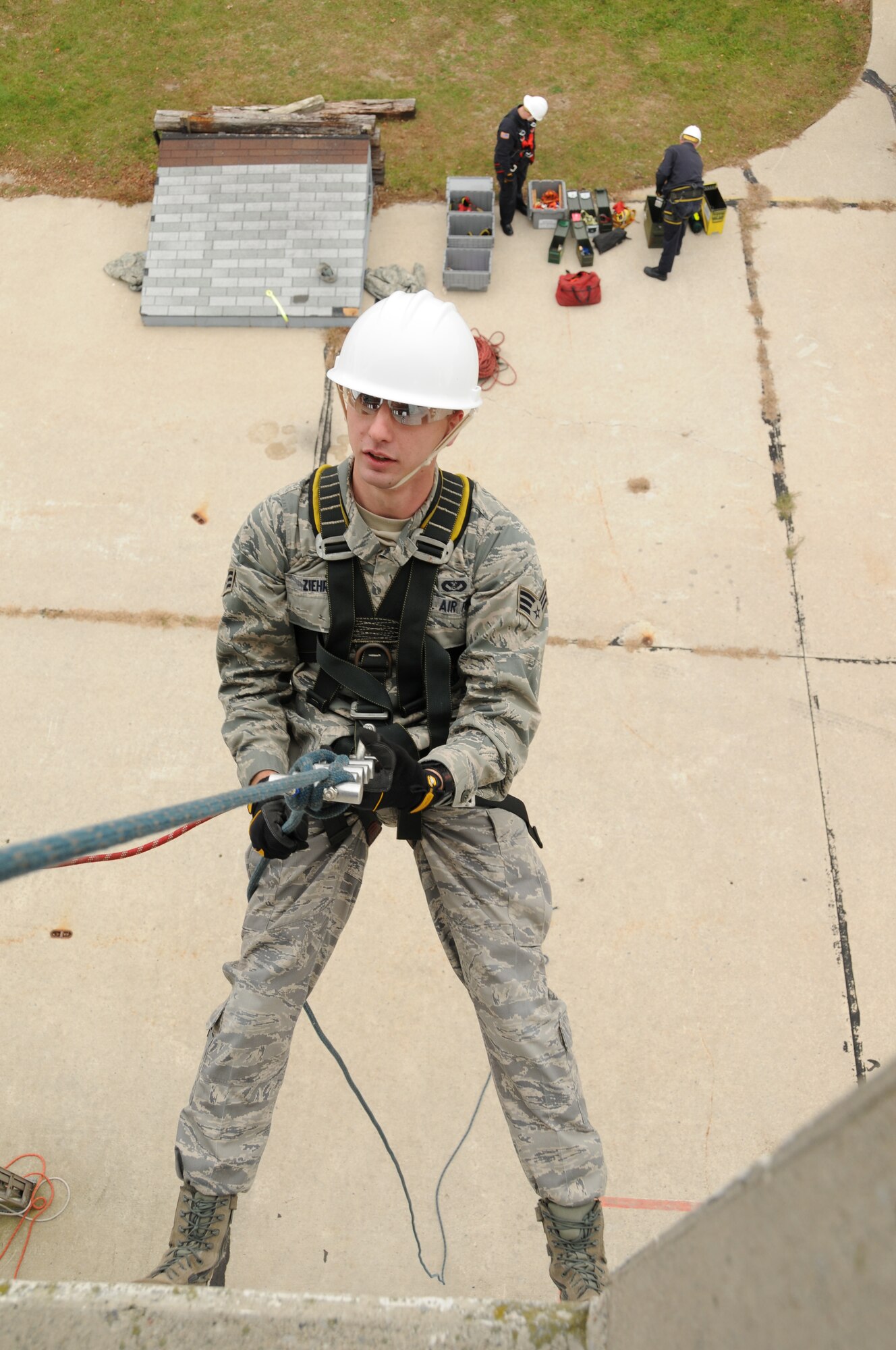 U.S. Air Force Senior Airman Adam Ziehr a firefighter with the 180th Fighter Wing rappels down the side of a training facility at the Toledo Fire and Rescue Department Training Academy, October 5, 2010.  Firefighters from the 180th Fighter Wing are participating in six days of training designed to prepare them for various rescue situations. (U.S. Air Force photo by Senior Airman Amber Williams/Released)
